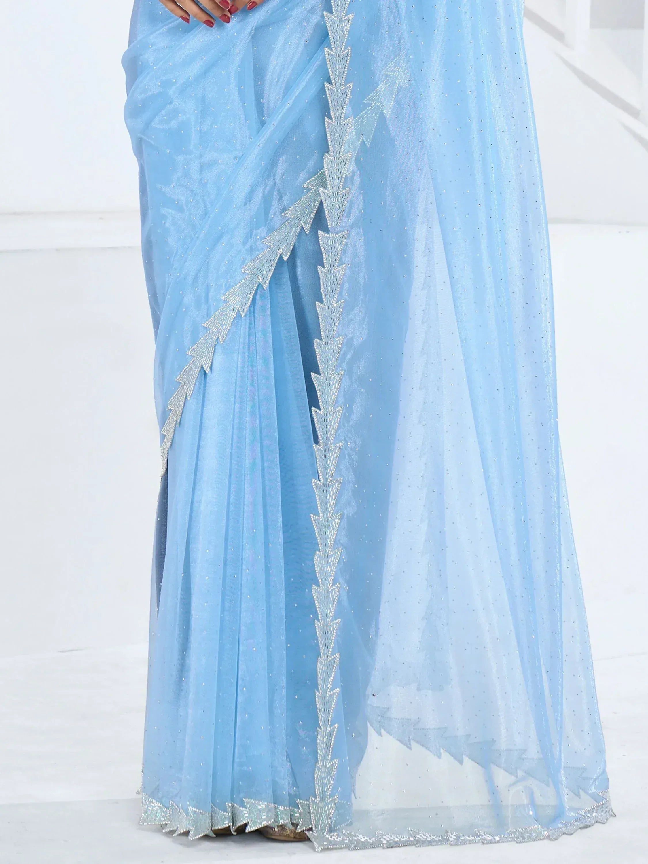 Light blue saree with silver sequin embroidery, perfect for Indian ethnic wear occasions