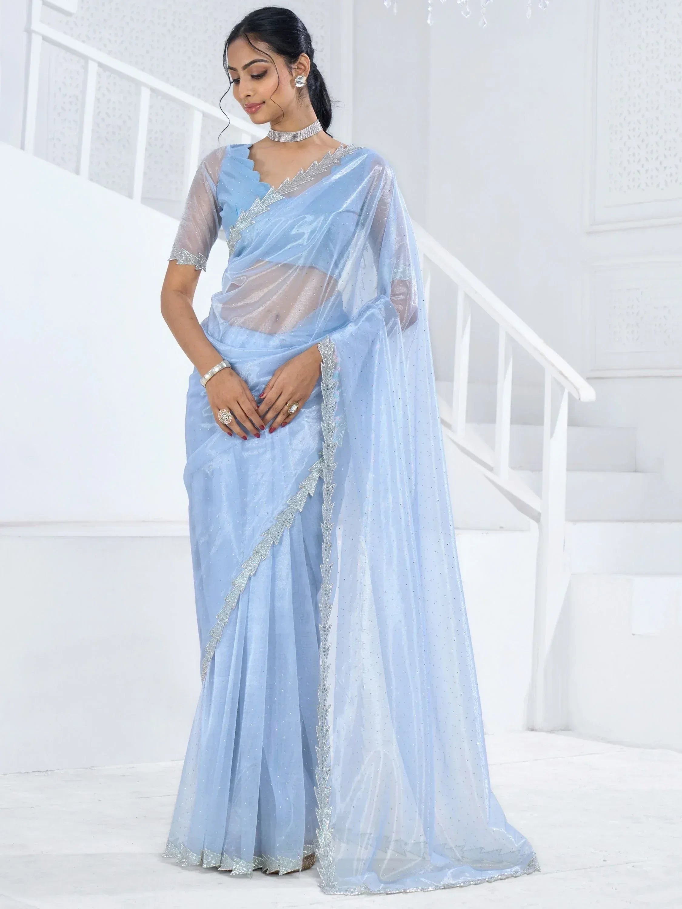 Light blue designer saree with silver embellishments, sheer blouse, ethnic wear for women