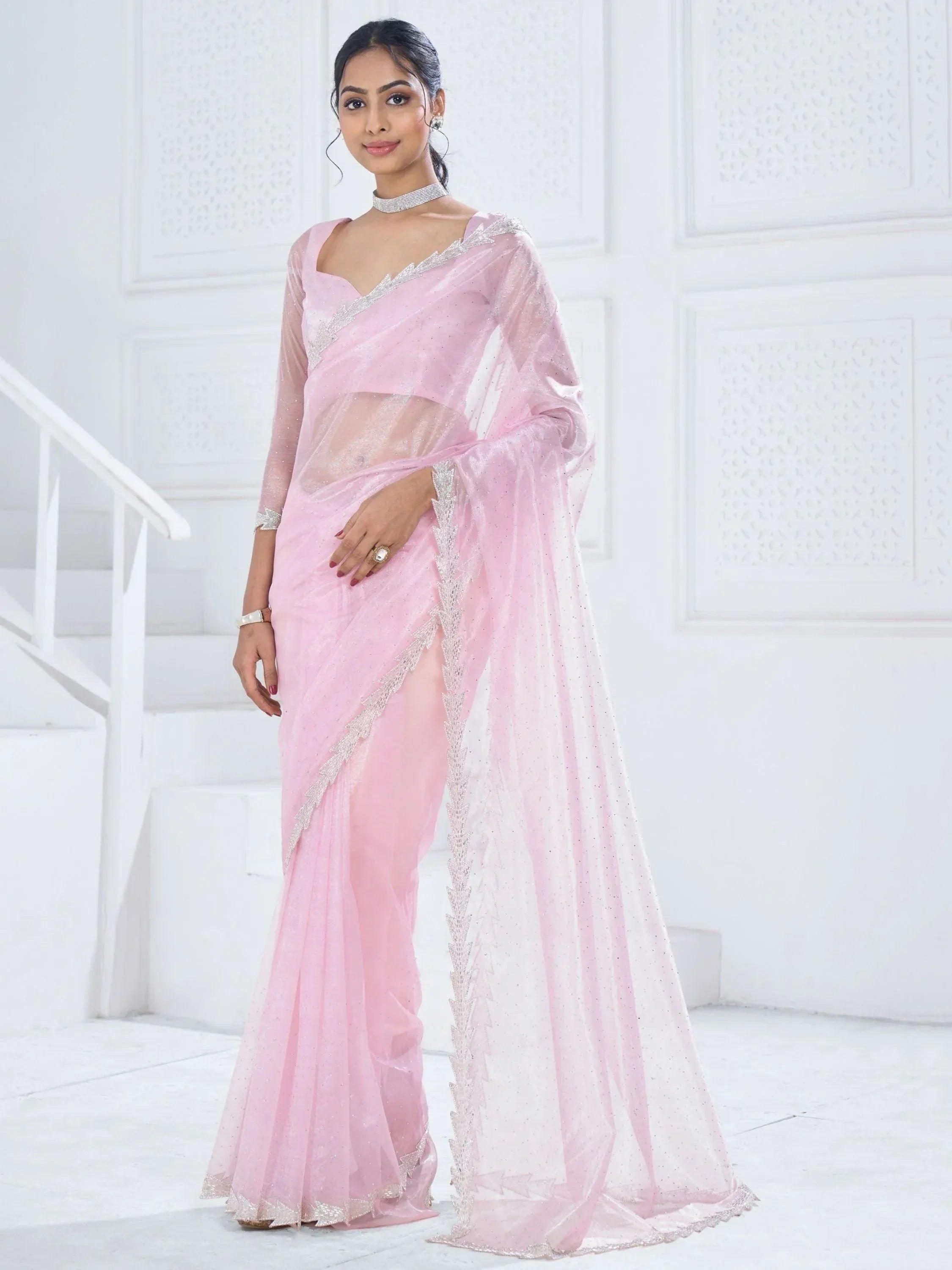 Pink sheer saree with silver embroidery, perfect for Indian ethnic wear occasions