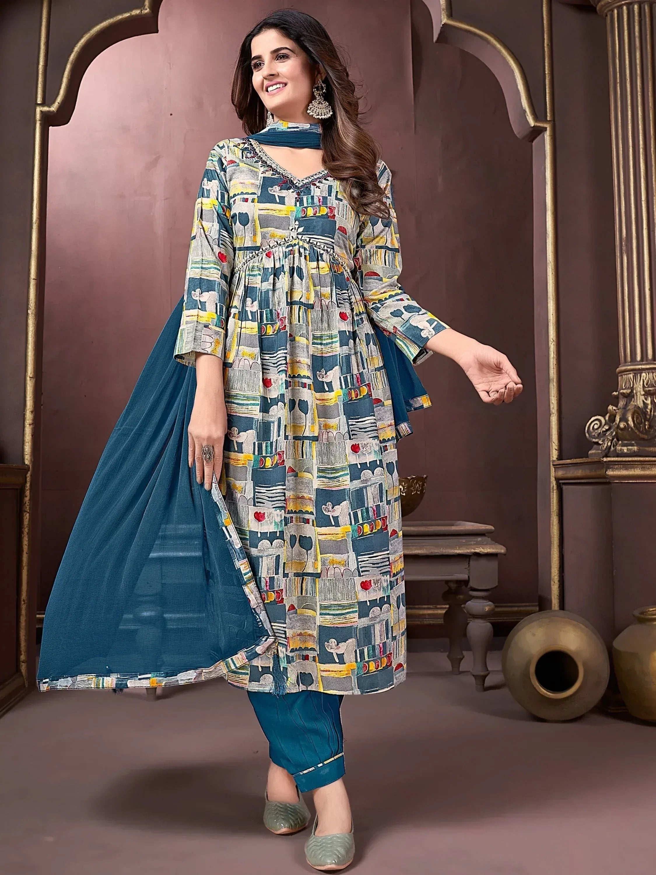 Stylish printed salwar kameez with teal dupatta, perfect for ethnic occasions