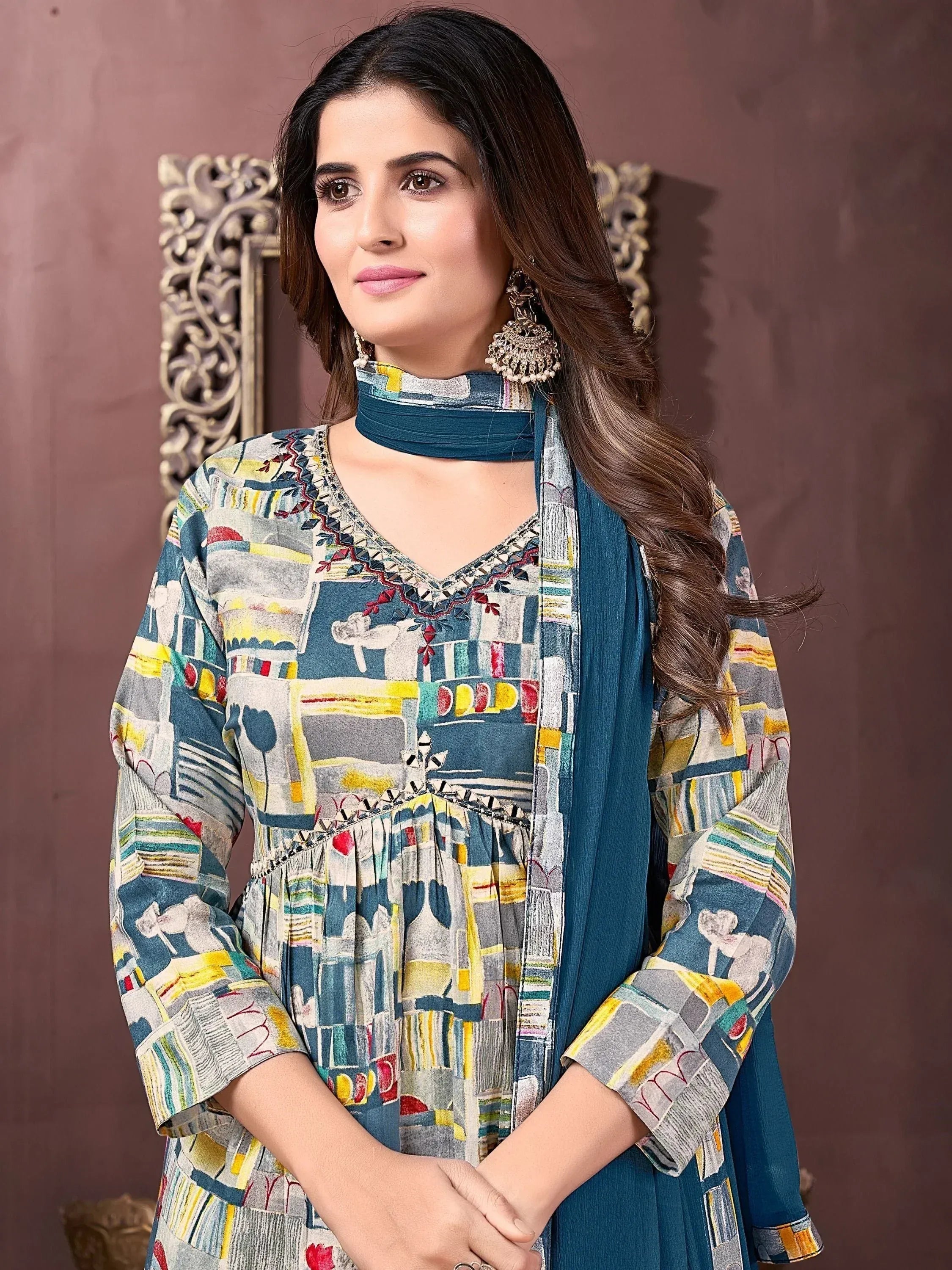Woman in colorful printed kurta with blue dupatta, ethnic wear for festive occasions