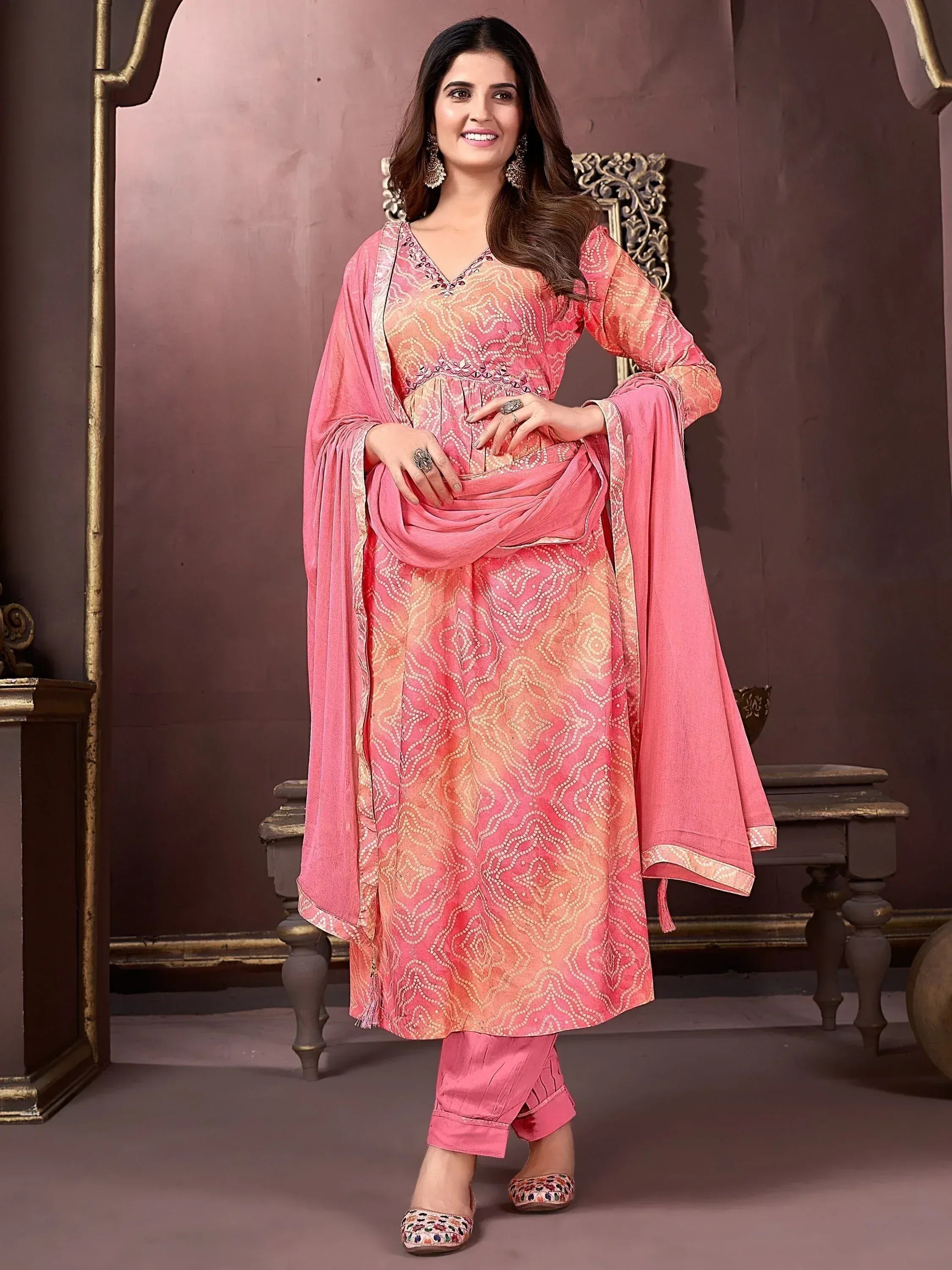 Pink printed salwar kameez with embroidery, perfect for Indian ethnic wear occasions