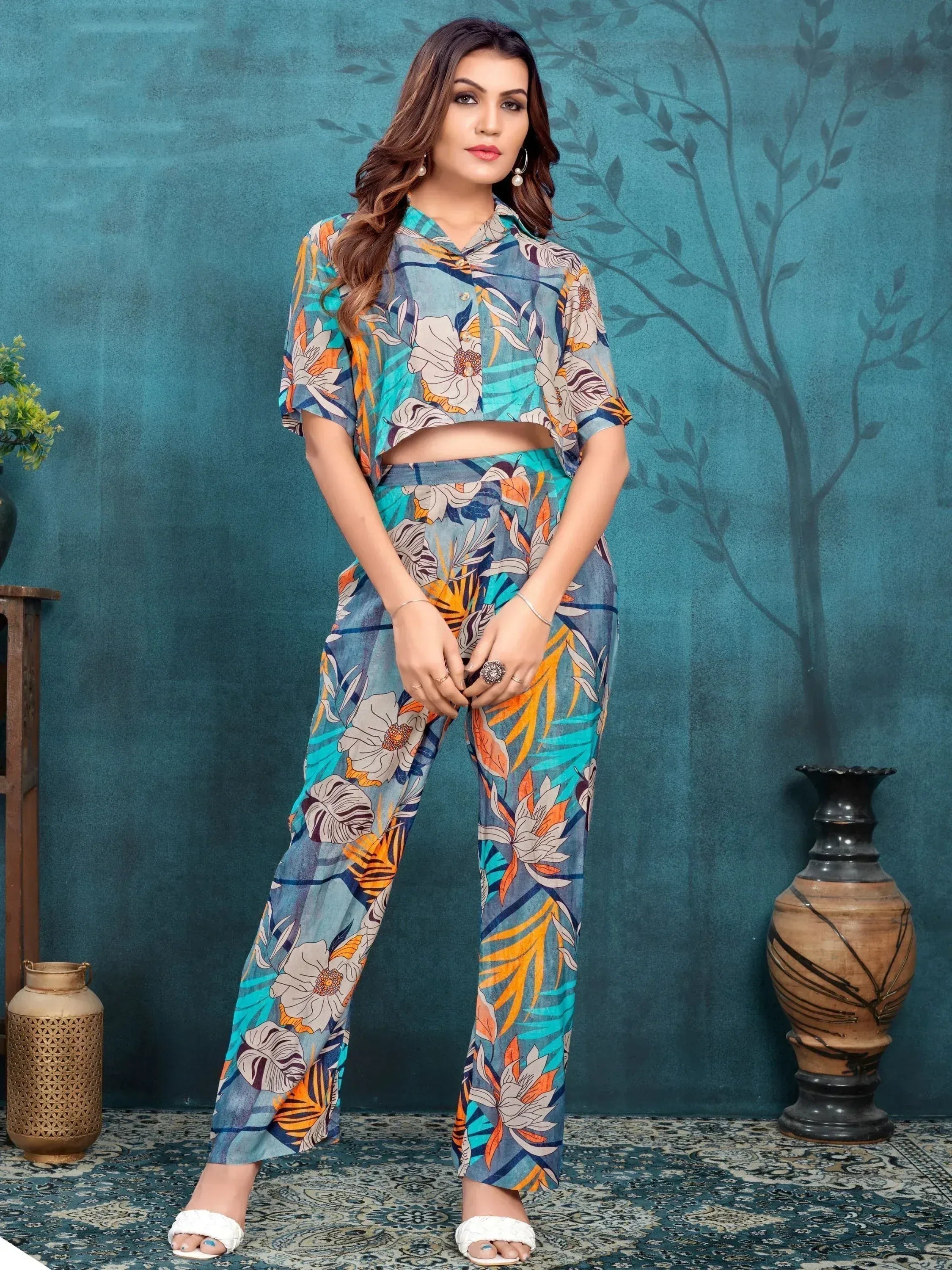 Woman in colorful floral print co-ord set with half sleeves and straight pants, indoor backdrop