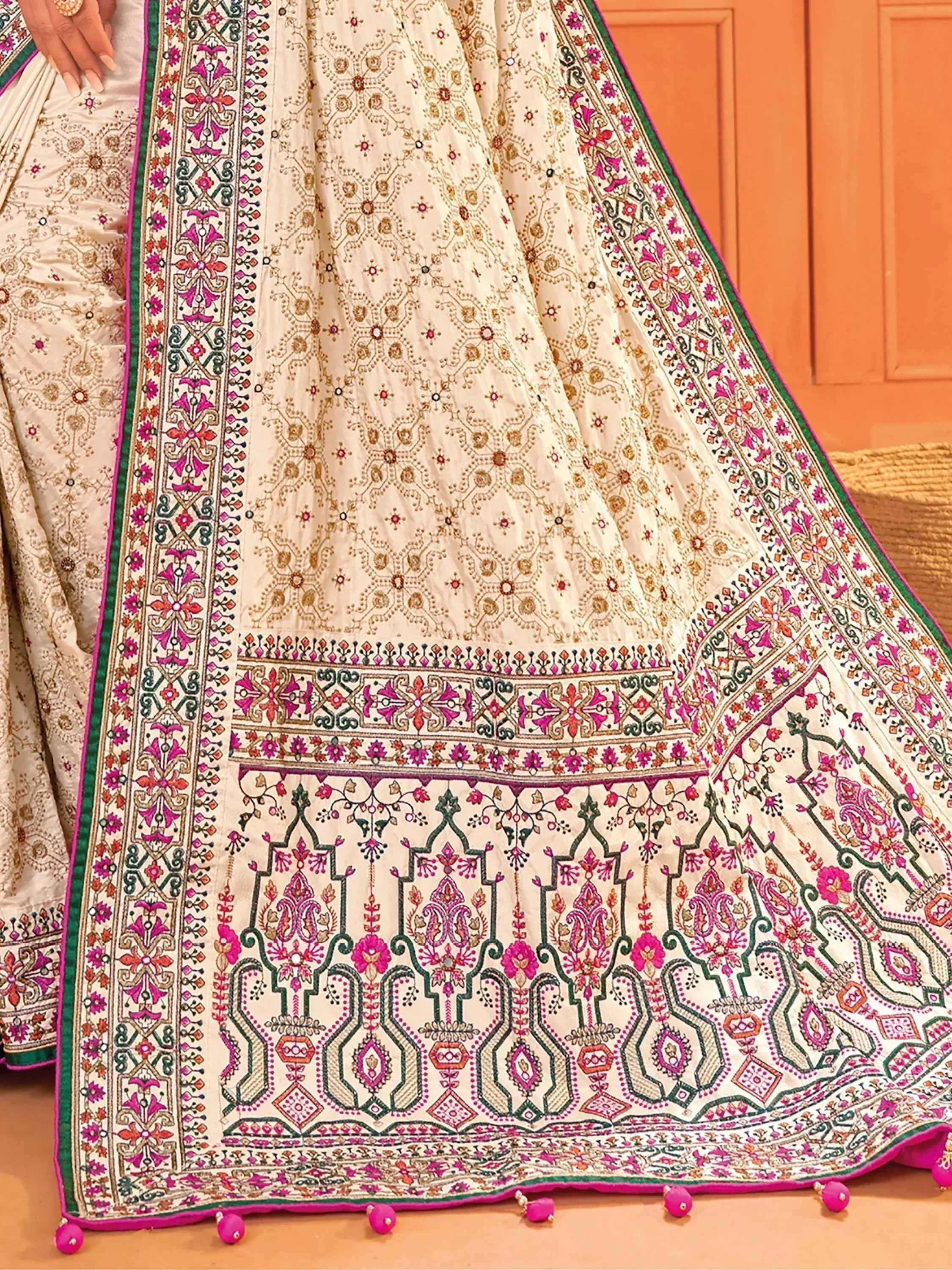 Cream designer lehenga with pink green embroidery and pom poms, Indian ethnic wear
