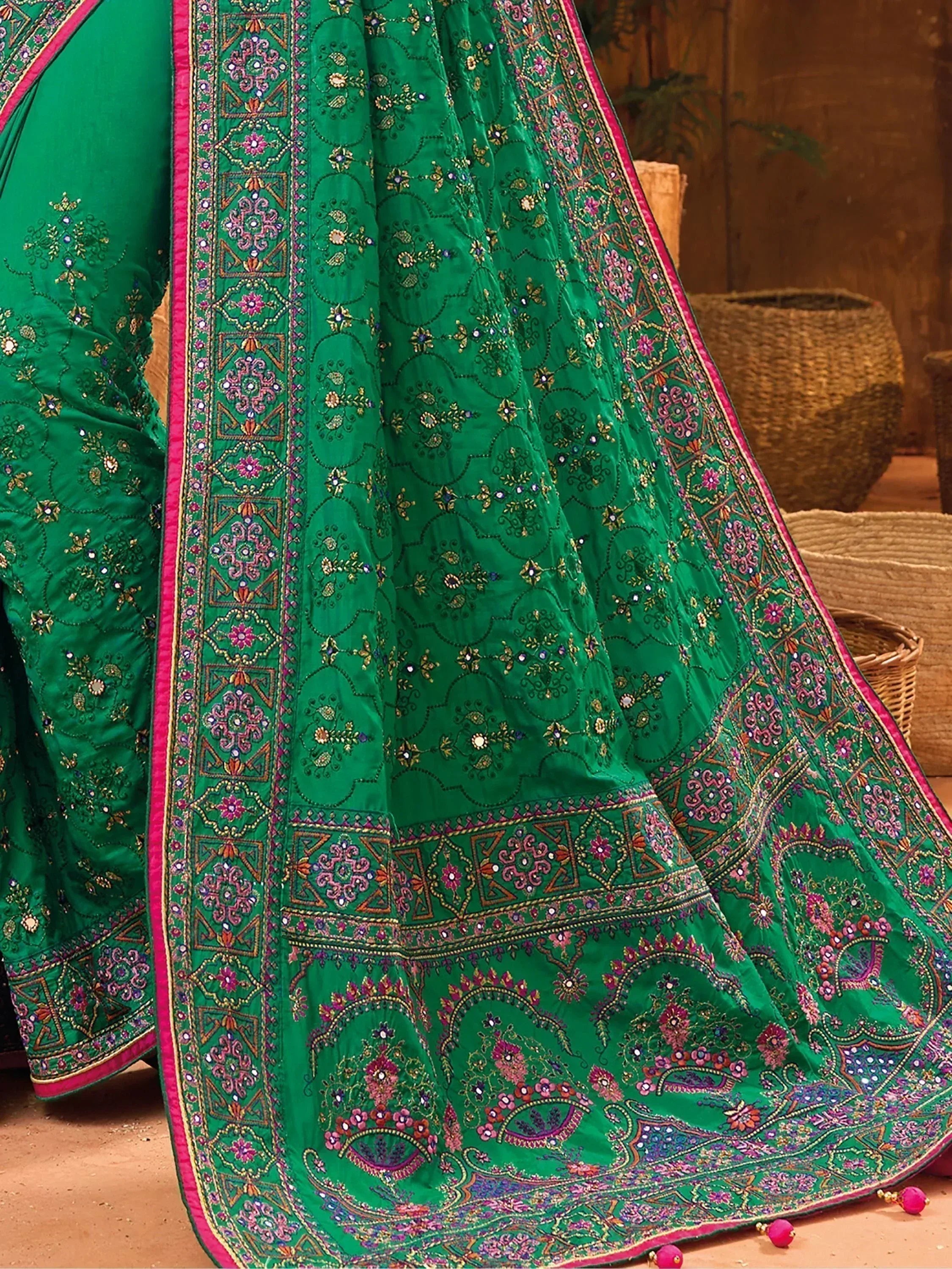 Emerald green embroidered lehenga choli with pink border, floral and mirror work, traditional Indian ethnic wear