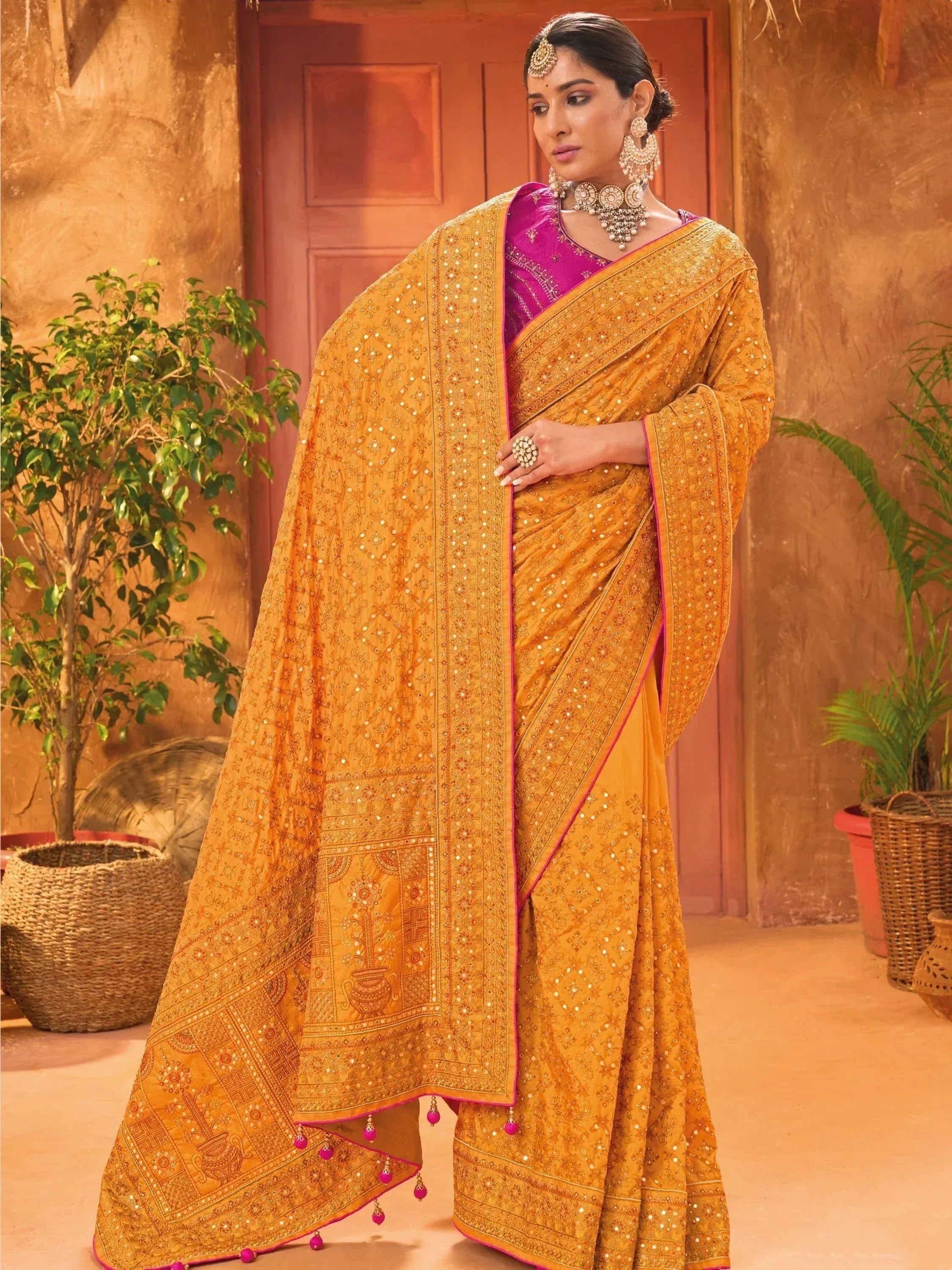 Golden embroidered saree with pink blouse, traditional Indian ethnic wear for women
