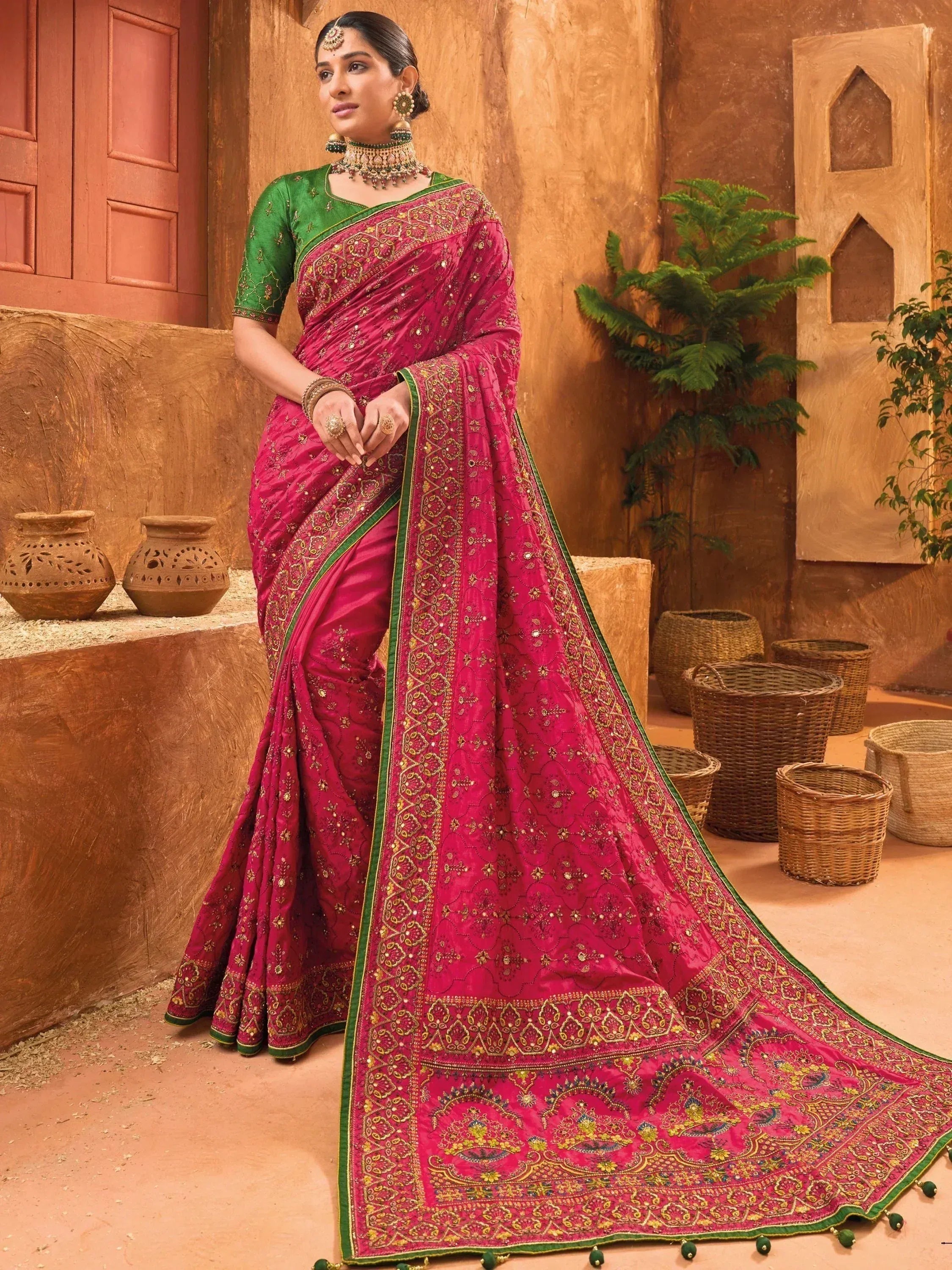 Pink and green embroidered saree with gold detailing, traditional Indian ethnic wear for women