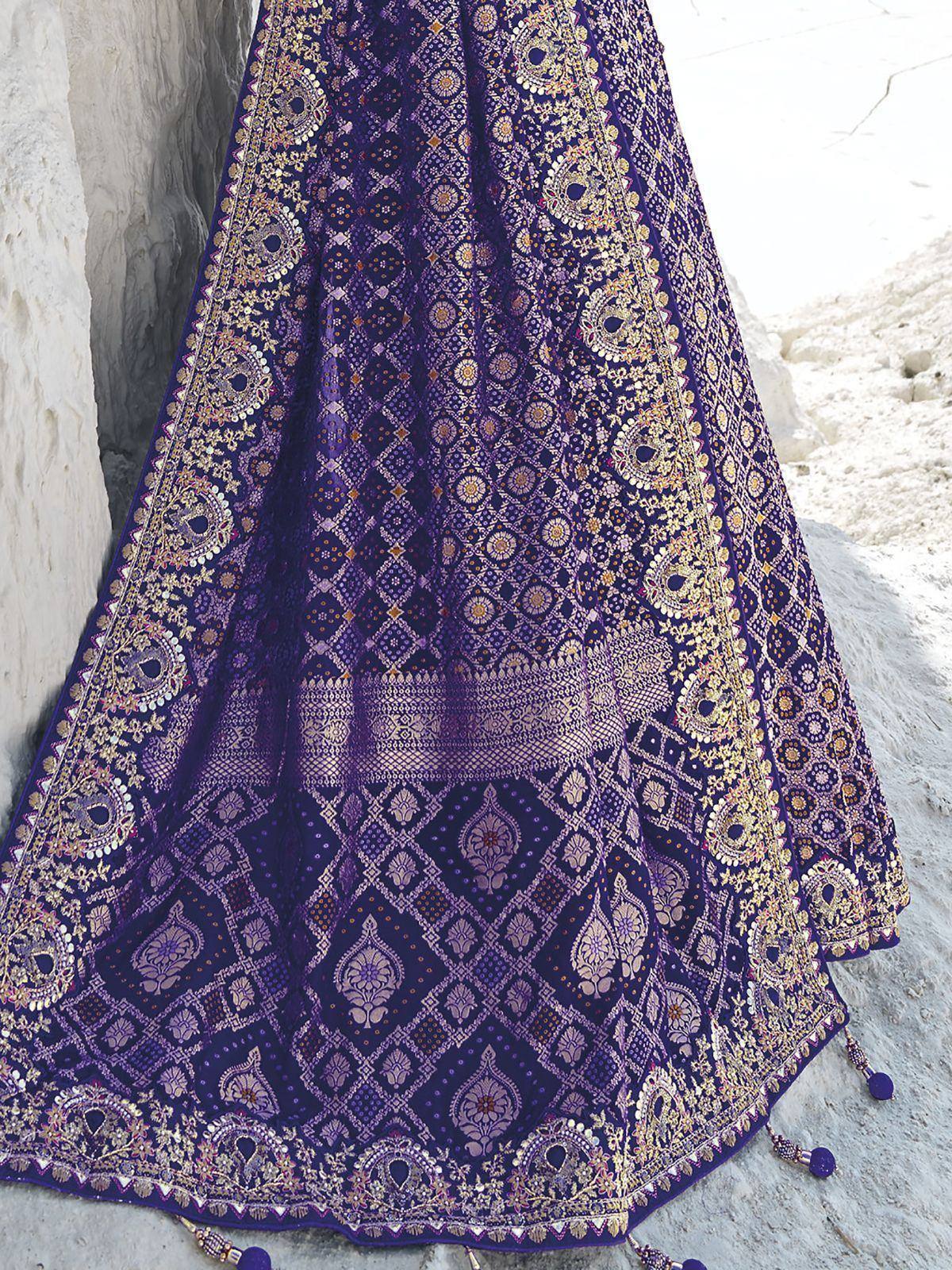 Purple designer lehenga with gold embroidery and tassels, ethnic Indian wear