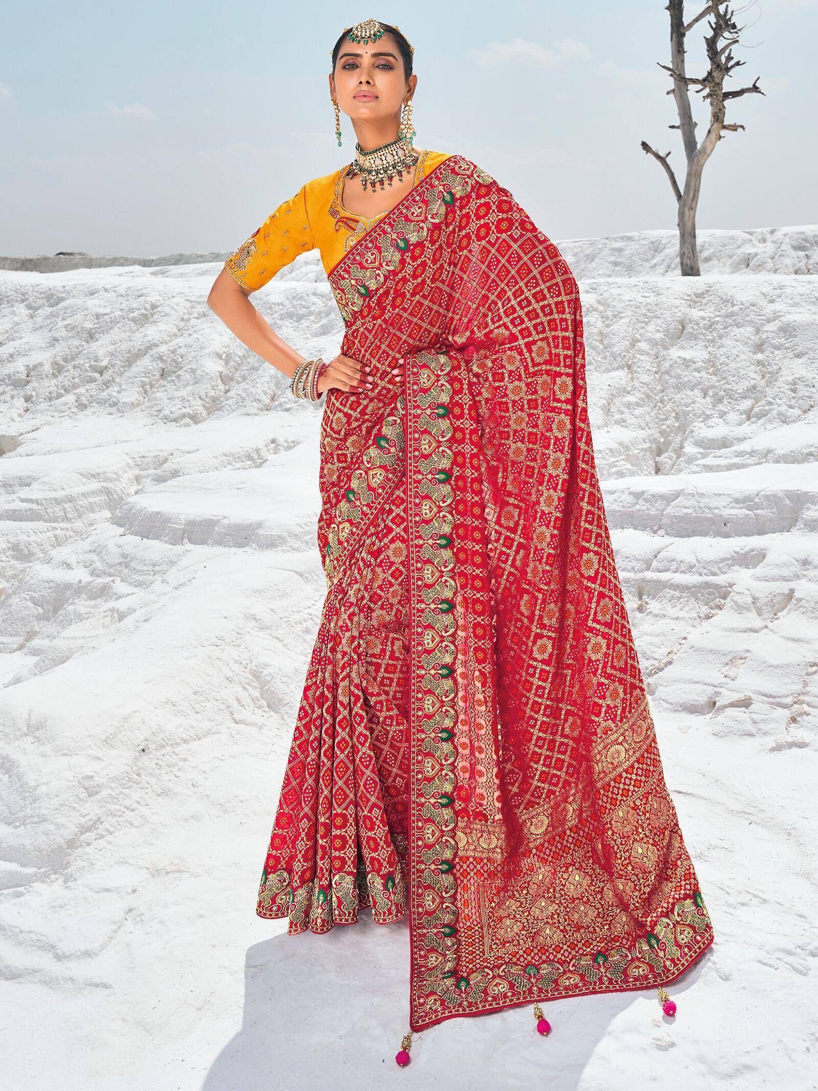 Red and gold embroidered saree with yellow blouse, traditional Indian ethnic wear for weddings and festivals