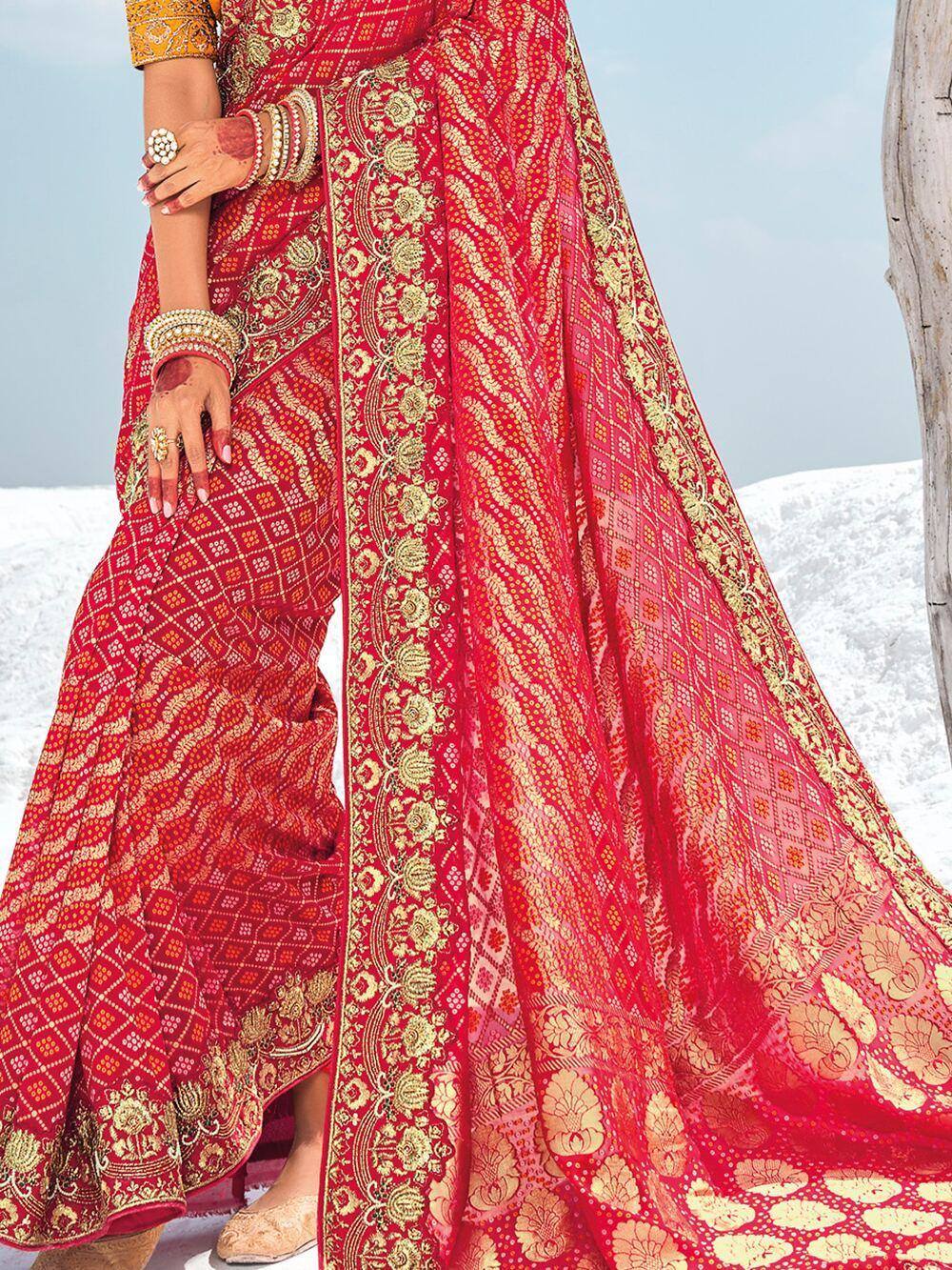 Red and gold embroidered lehenga choli with intricate floral patterns, perfect for Indian weddings and festive occasions.