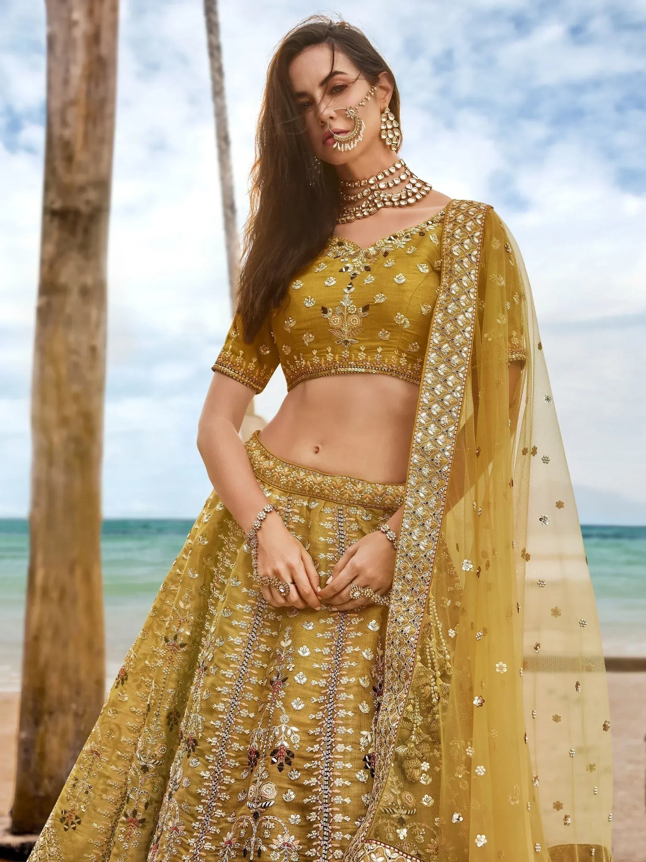 Golden embroidered lehenga choli with dupatta, perfect for Indian weddings and festive occasions