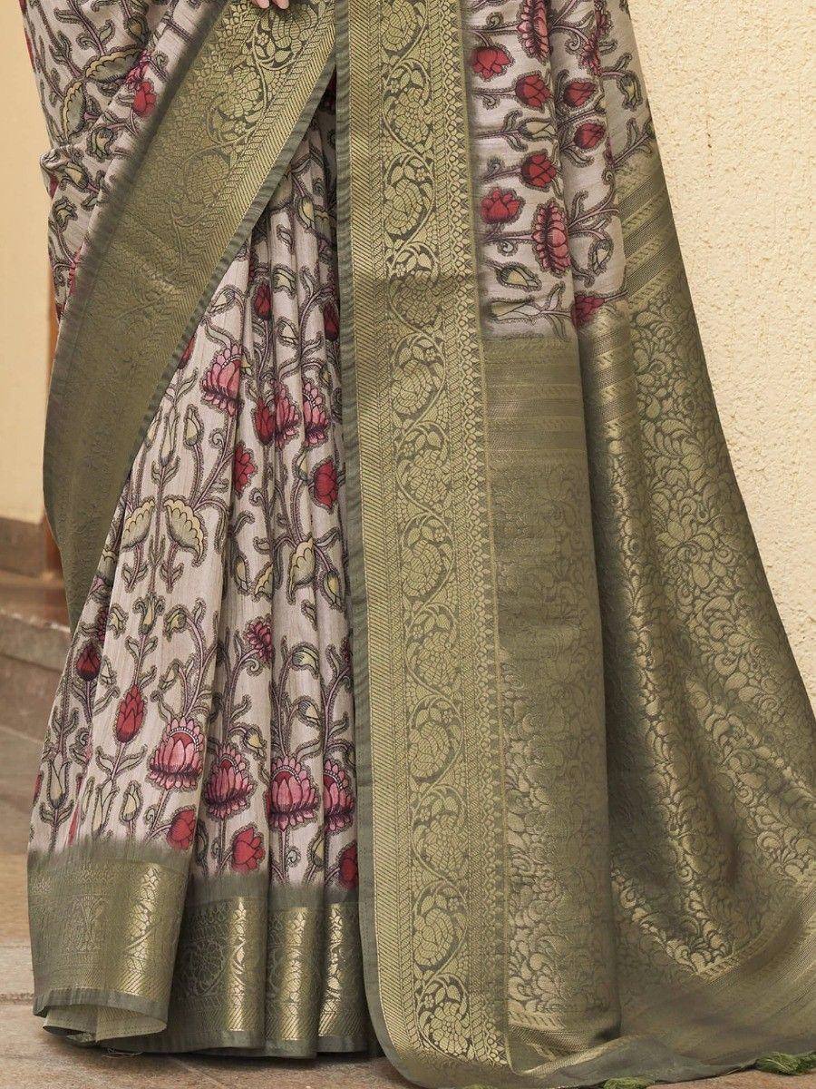 Elegant floral print saree with olive green border, perfect for Indian ethnic wear occasions.