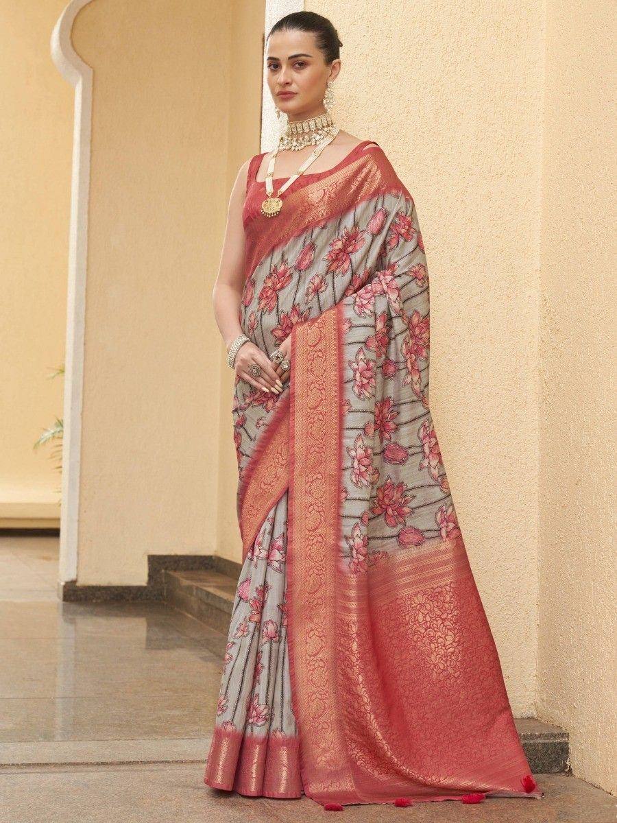 Grey and pink floral saree with gold border, styled with traditional jewelry for ethnic wear