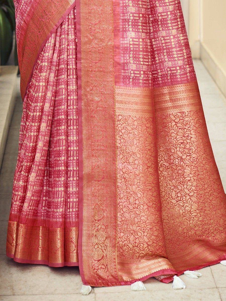 Pink and gold designer saree with intricate woven patterns and tassels, ideal for ethnic occasions