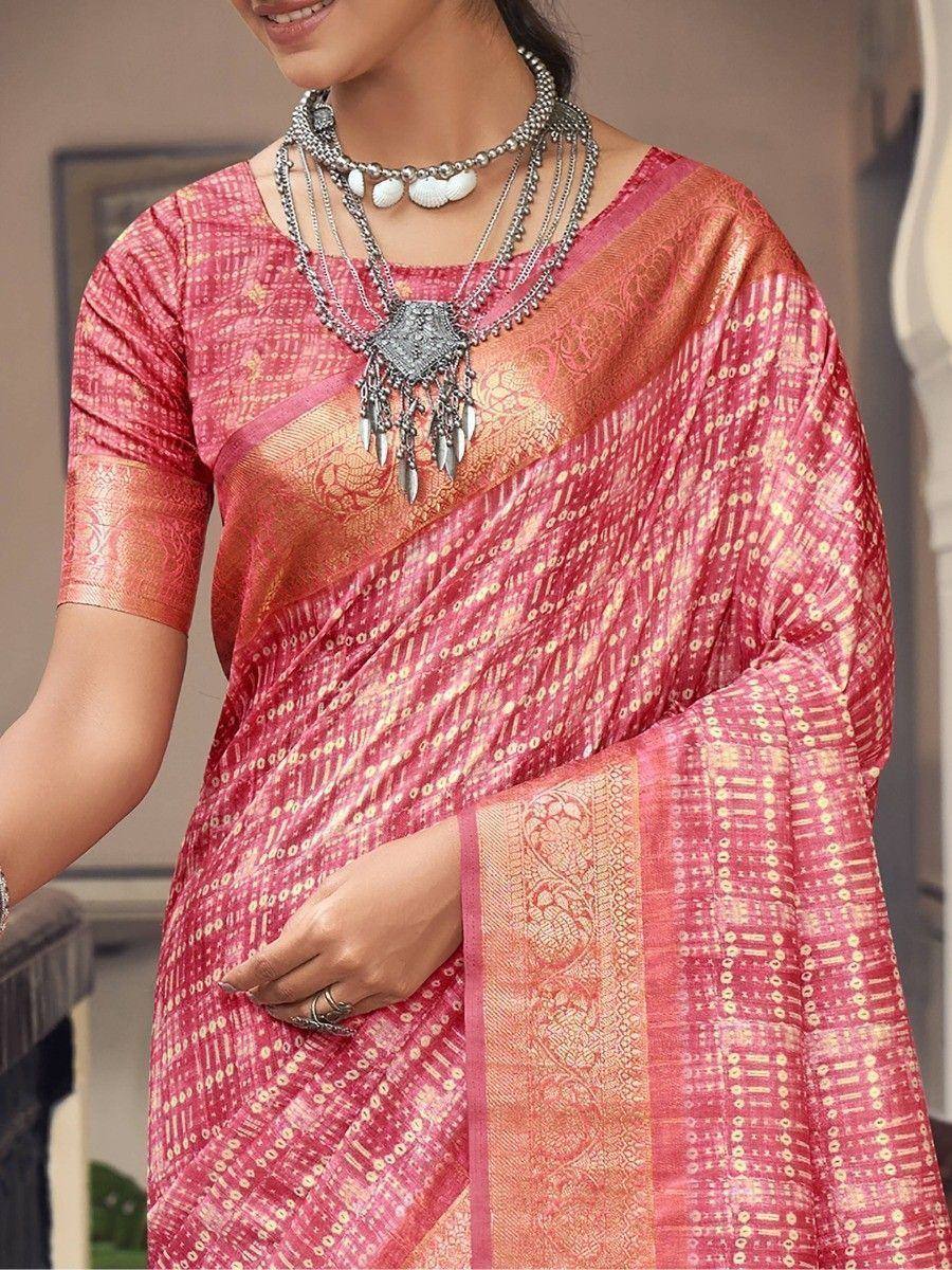 Pink and gold printed saree with ethnic jewelry, perfect for Indian festive occasions