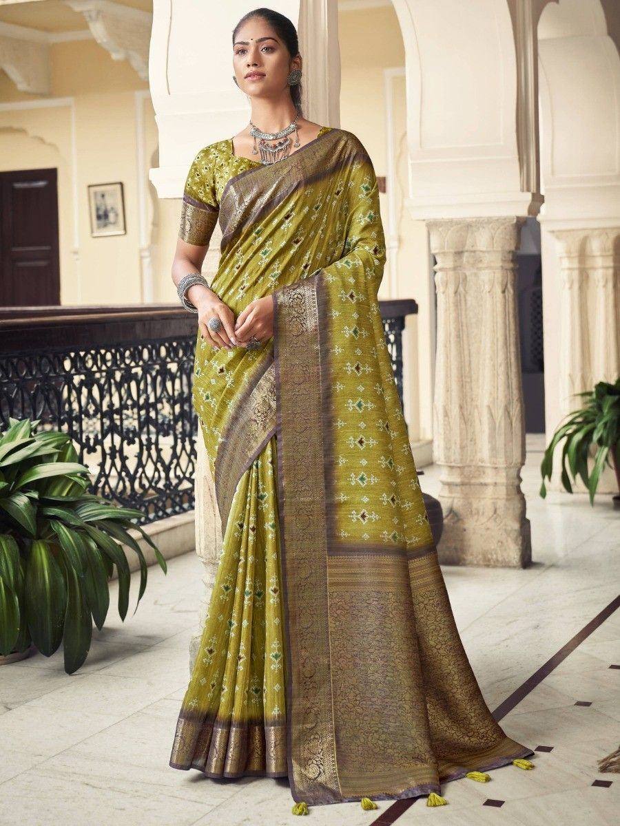 Elegant green saree with intricate gold embroidery and border, perfect for Indian ethnic occasions.