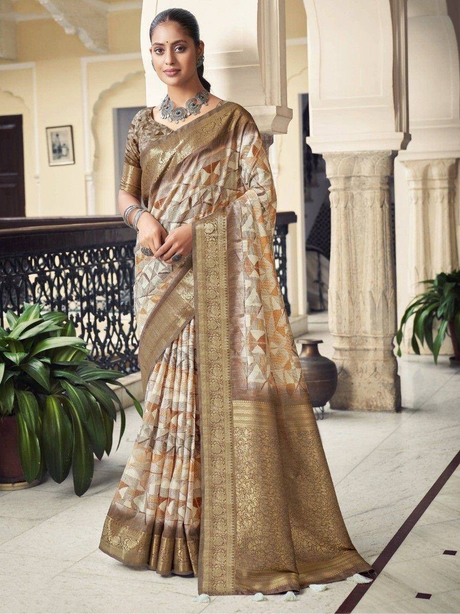 Elegant beige and gold printed saree with intricate border, perfect for Indian ethnic occasions