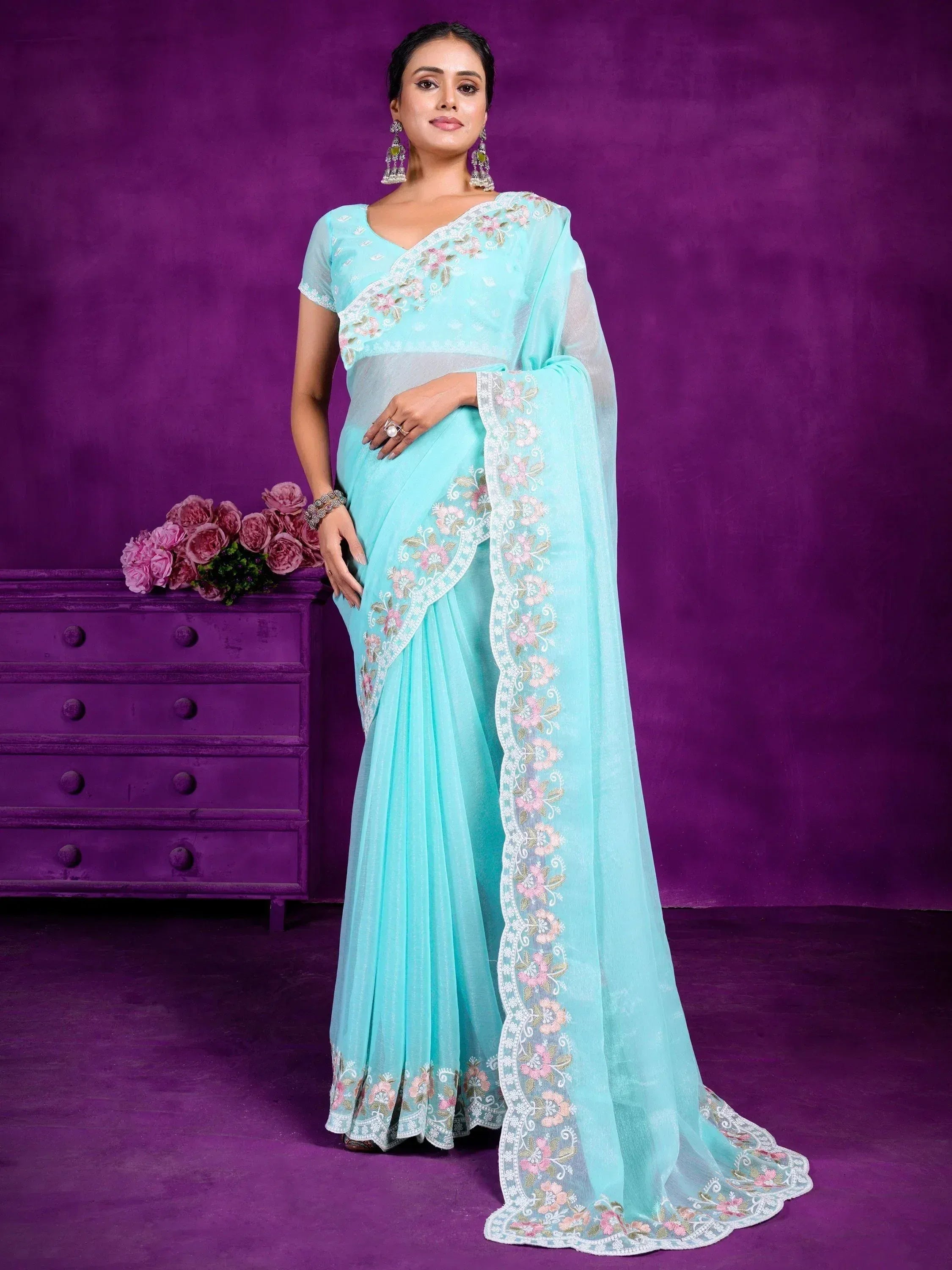 Light blue embroidered saree with floral border, perfect for Indian ethnic wear occasions