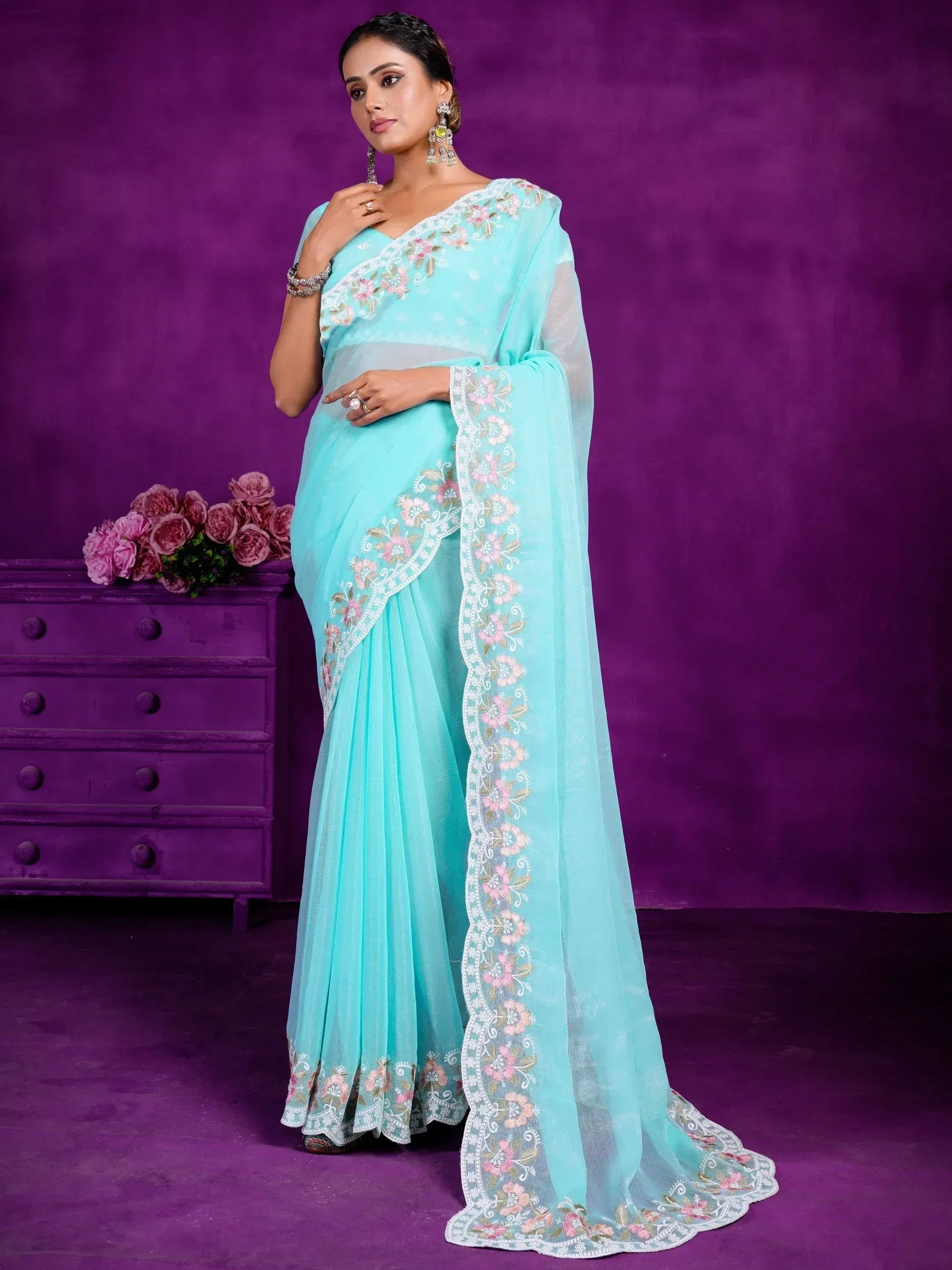 Mint green embroidered saree with floral detailing, perfect for Indian ethnic wear occasions
