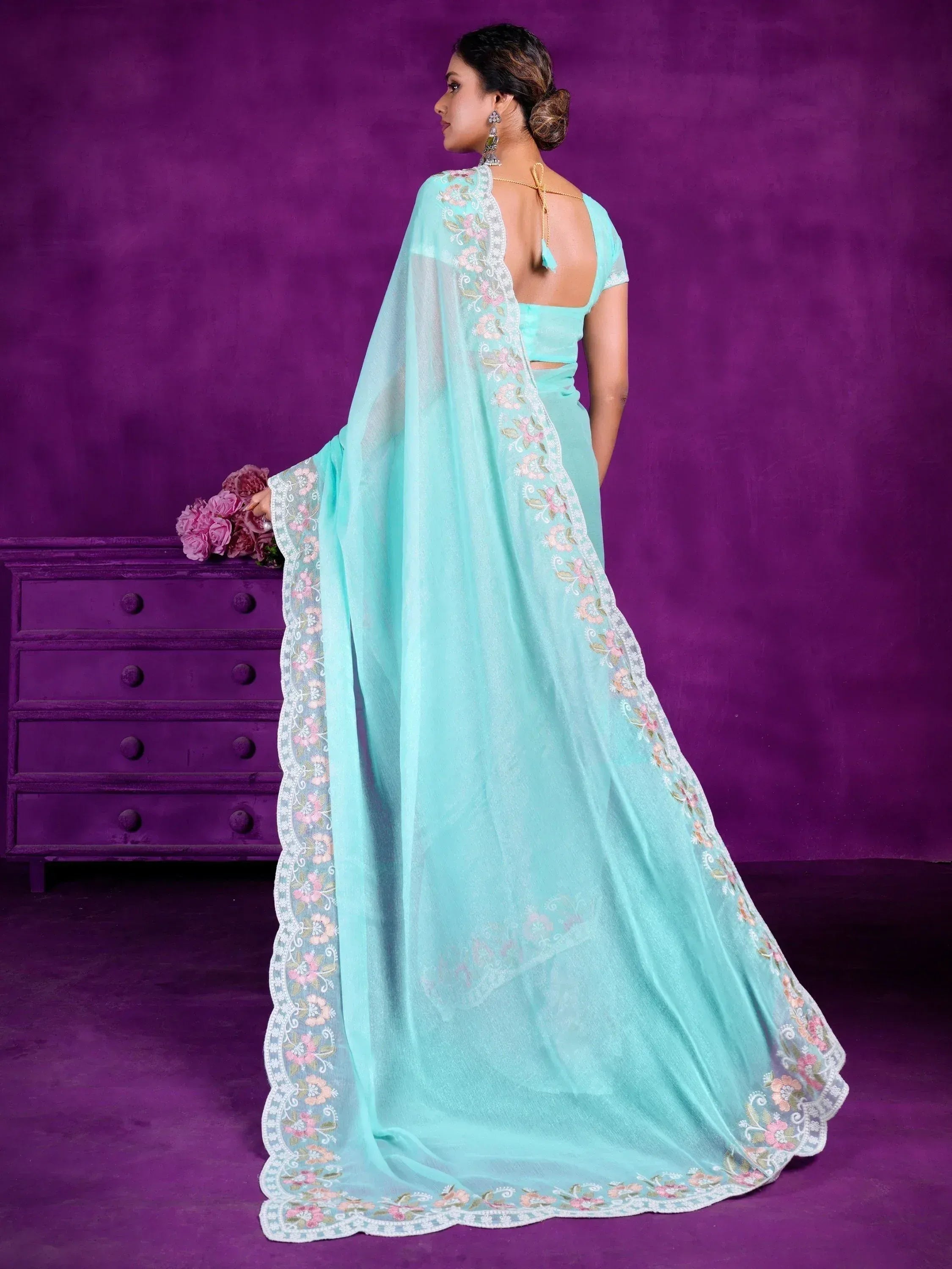 Mint green designer saree with floral embroidery, backless blouse, perfect for Indian ethnic wear occasions.