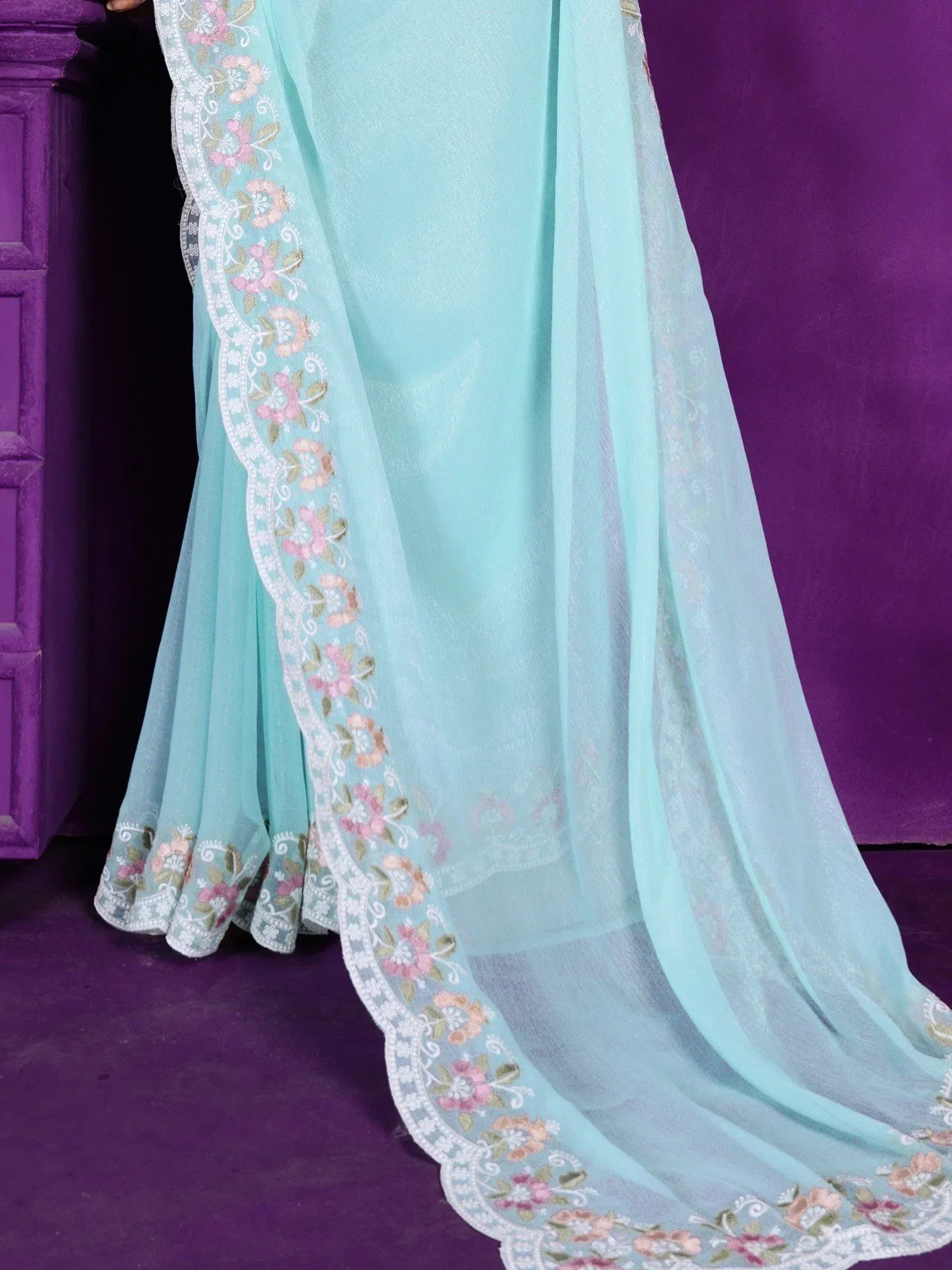 Mint green ethnic gown with floral embroidery and scalloped hem, perfect for Indian occasions