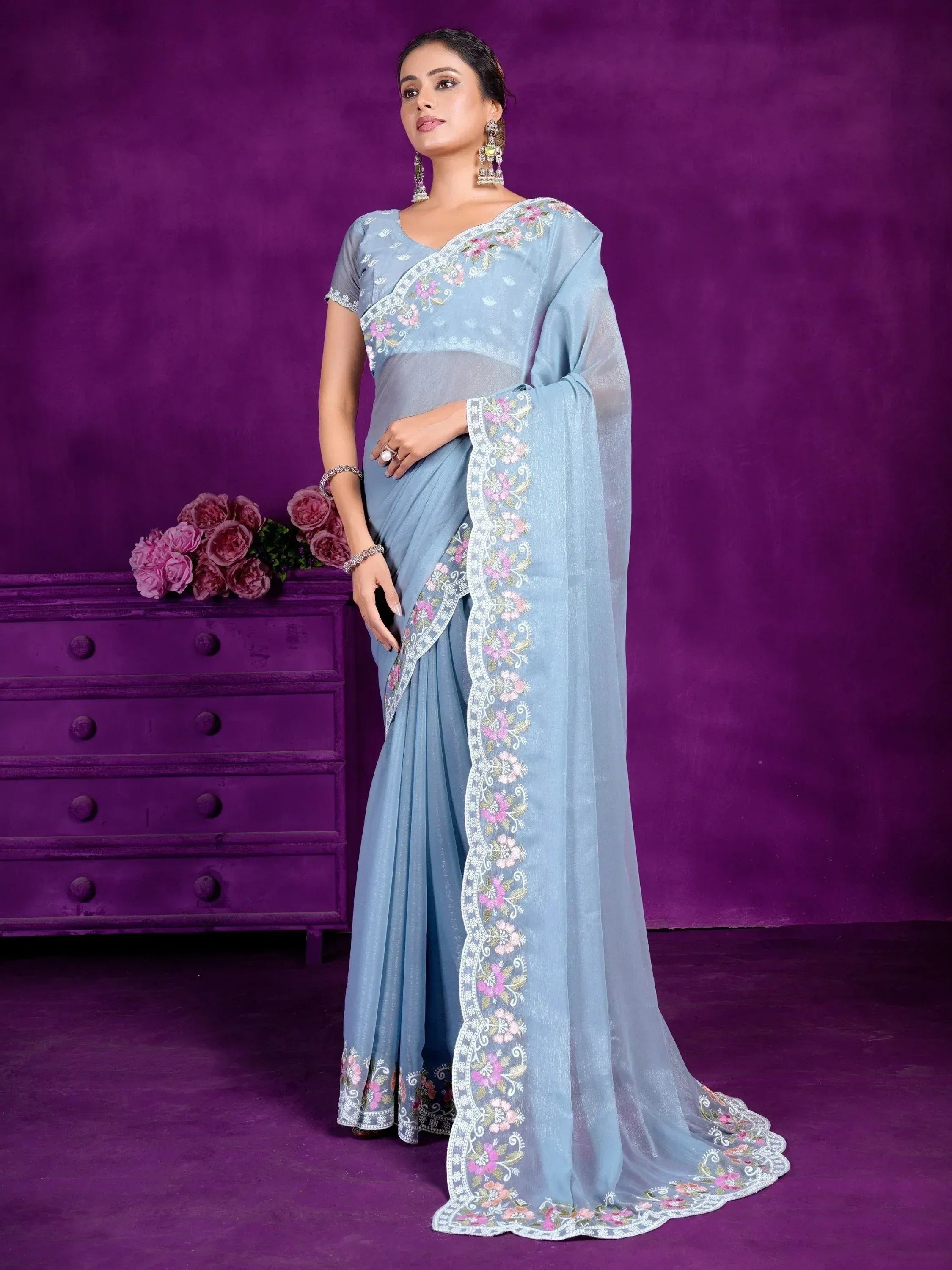 Light blue embroidered saree with floral border, perfect for Indian ethnic occasions