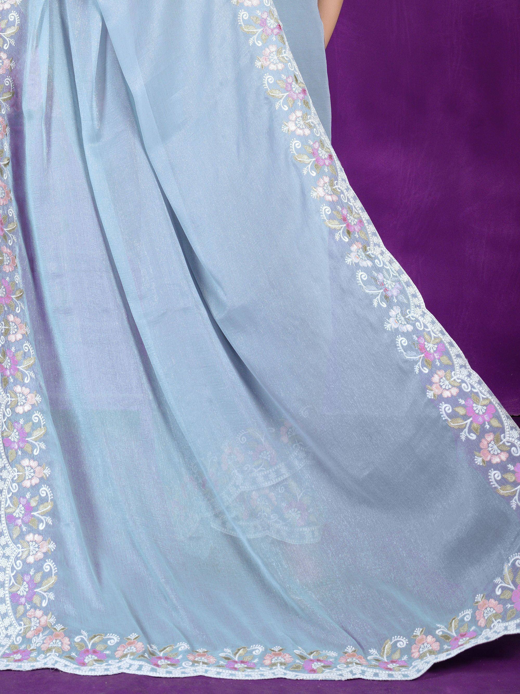 Light blue ethnic gown with floral embroidery and lace trim, perfect for Indian occasions.