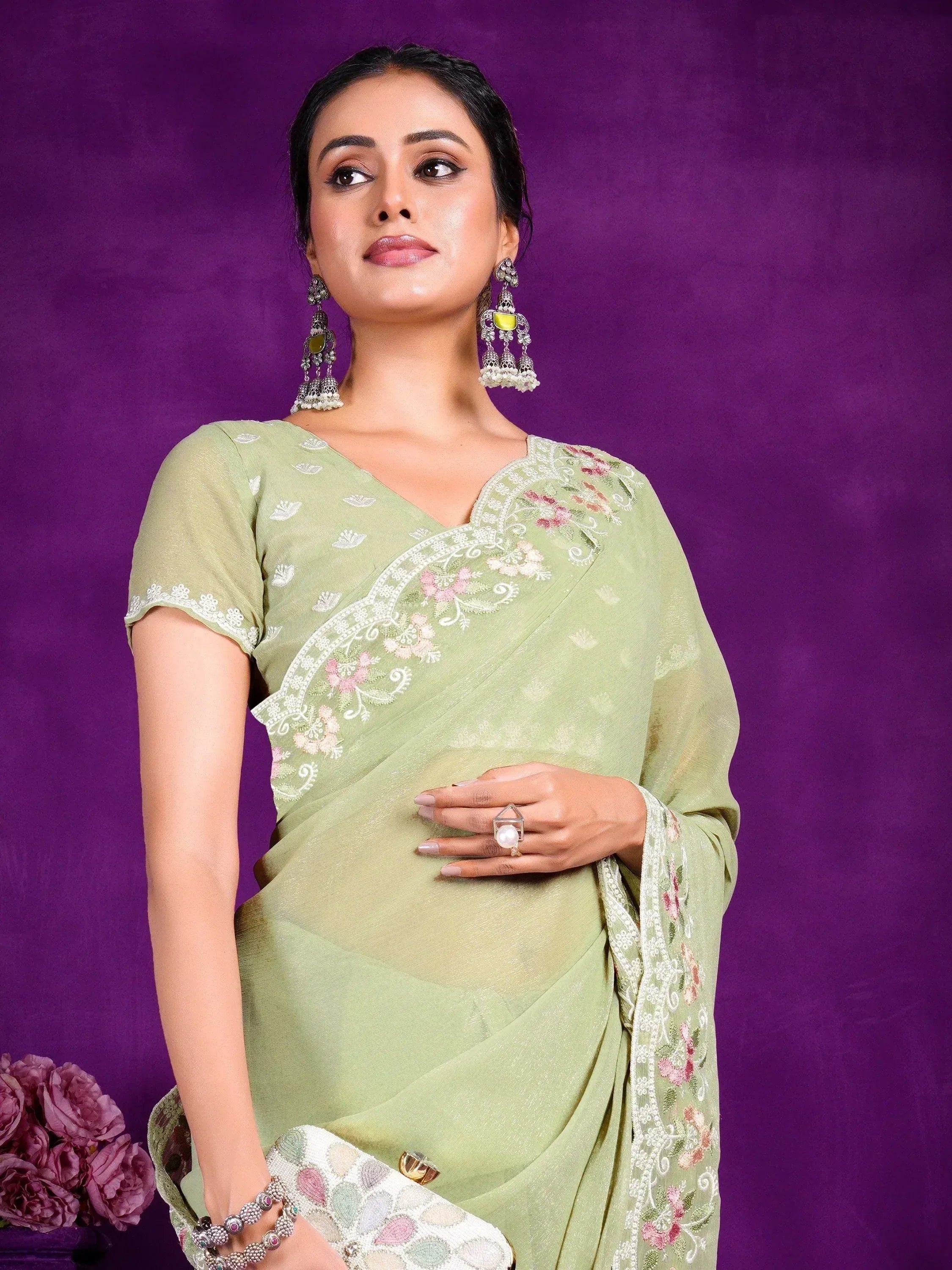 Light green embroidered saree with floral design, perfect for ethnic occasions and Indian wear.