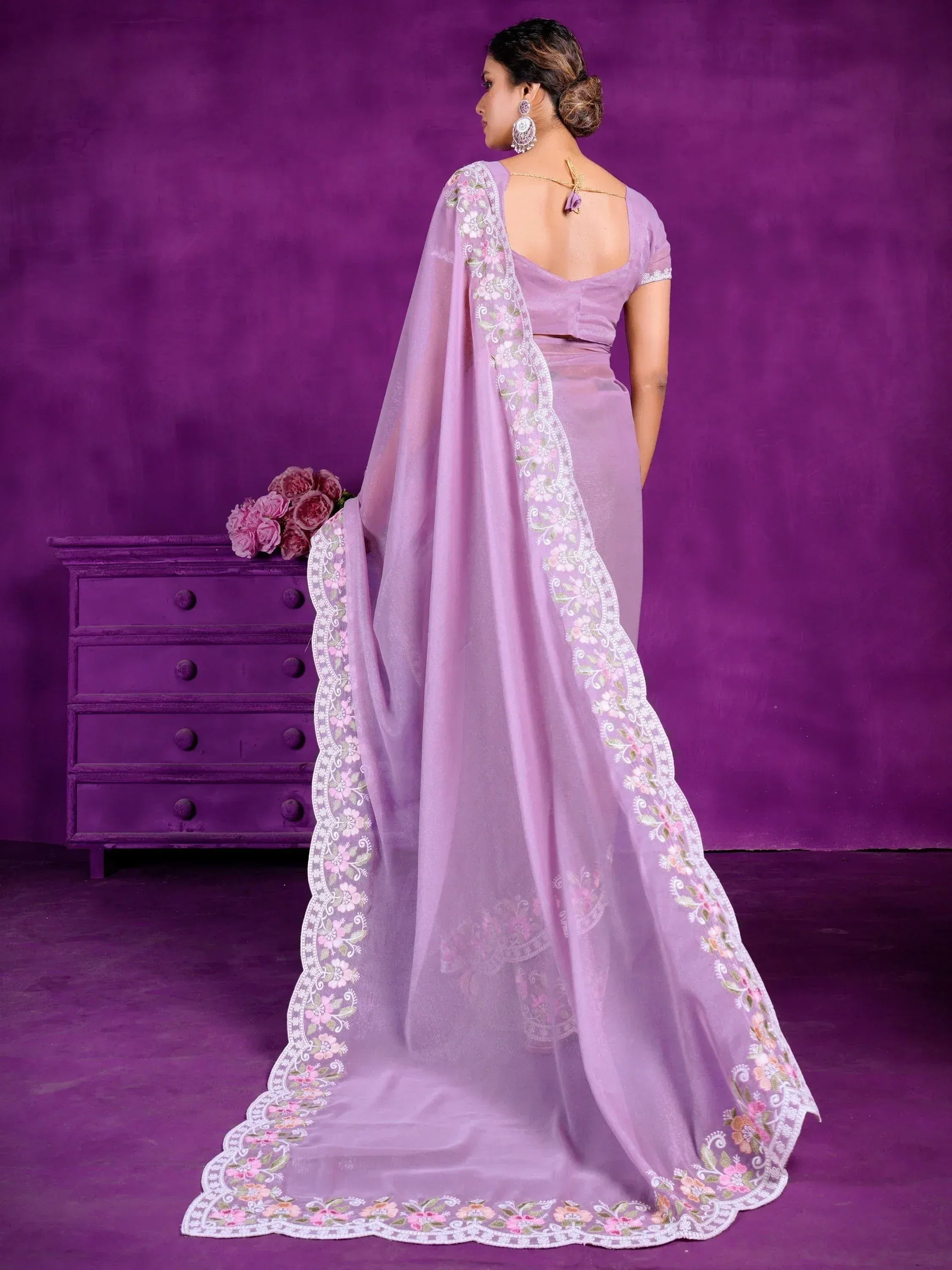 Lavender designer saree with floral embroidered border, backless blouse, and sheer dupatta for ethnic occasions