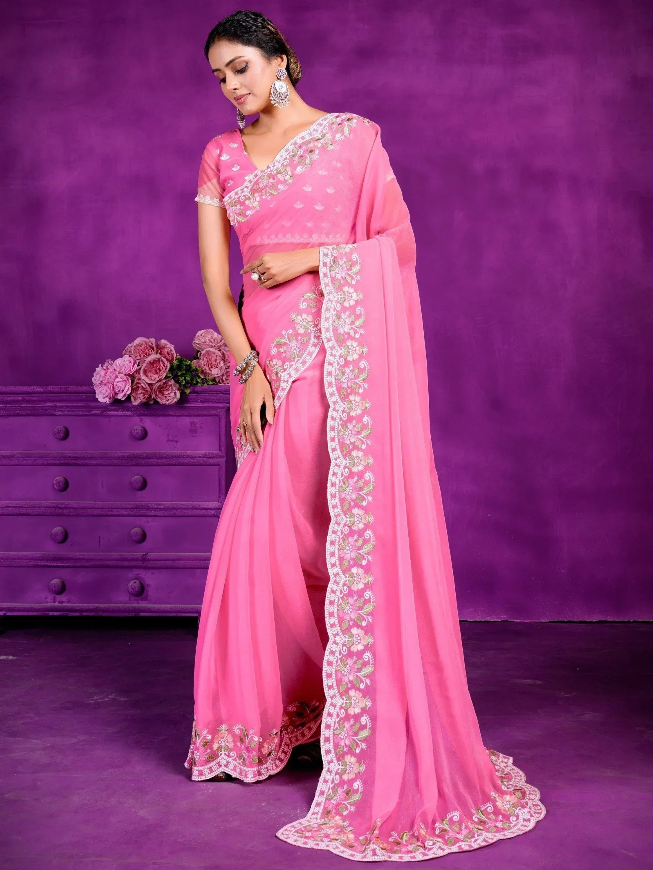 Pink embroidered saree with floral border, perfect for Indian ethnic occasions and weddings