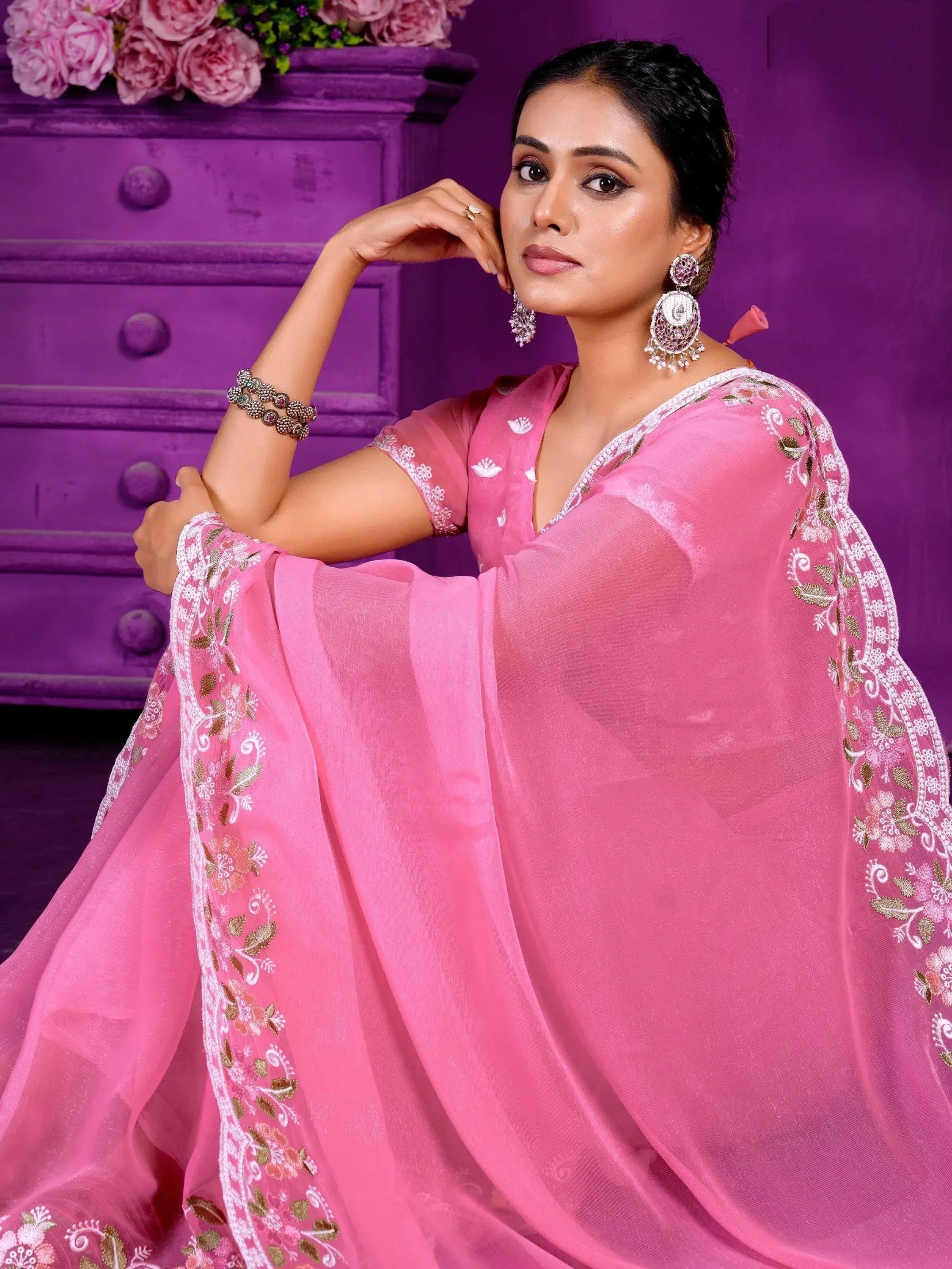 Pink embroidered ethnic gown with floral detailing, perfect for Indian occasions and festive wear.