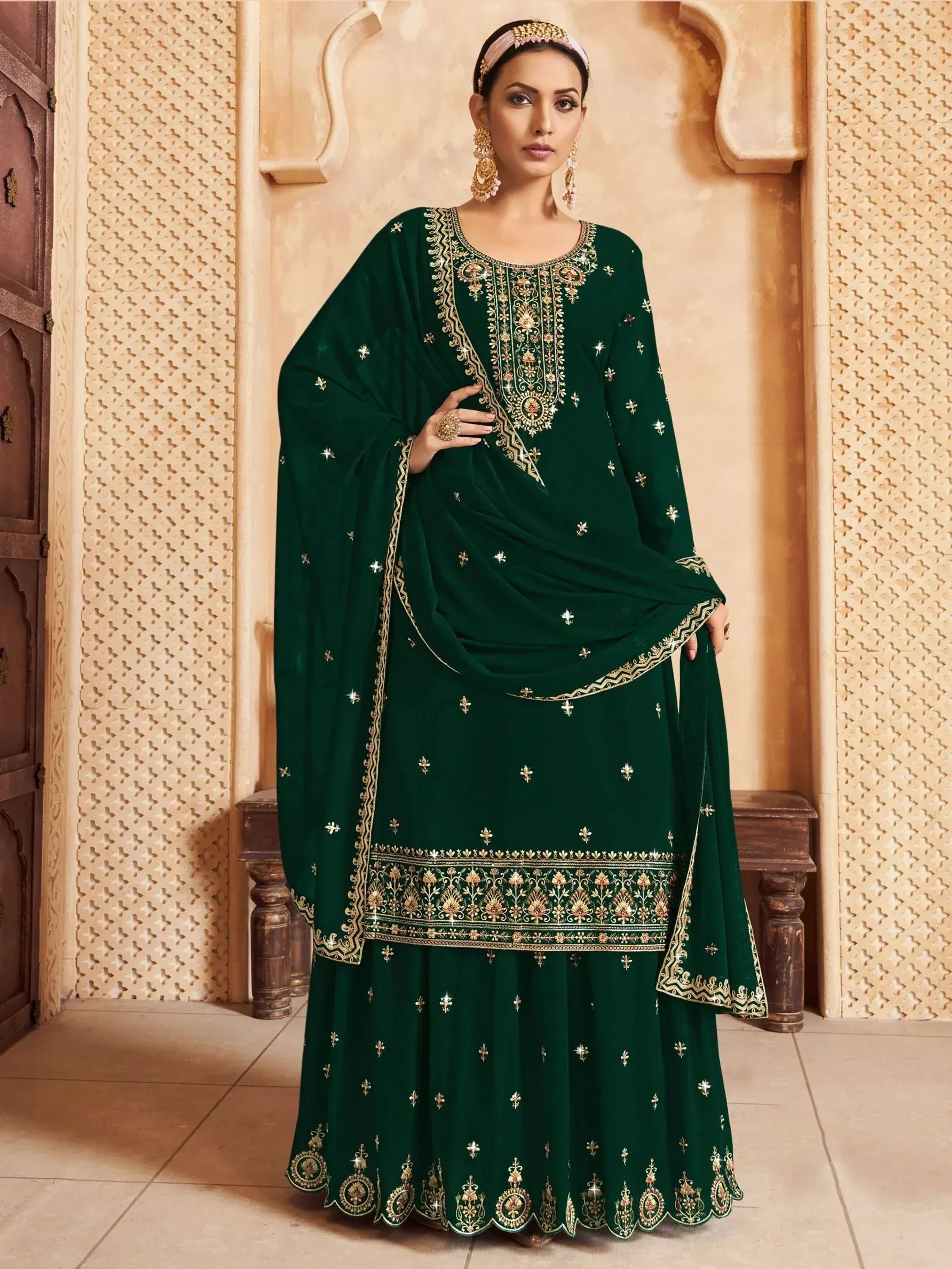 Emerald green embroidered salwar kameez with gold detailing, perfect for Indian ethnic wear occasions.