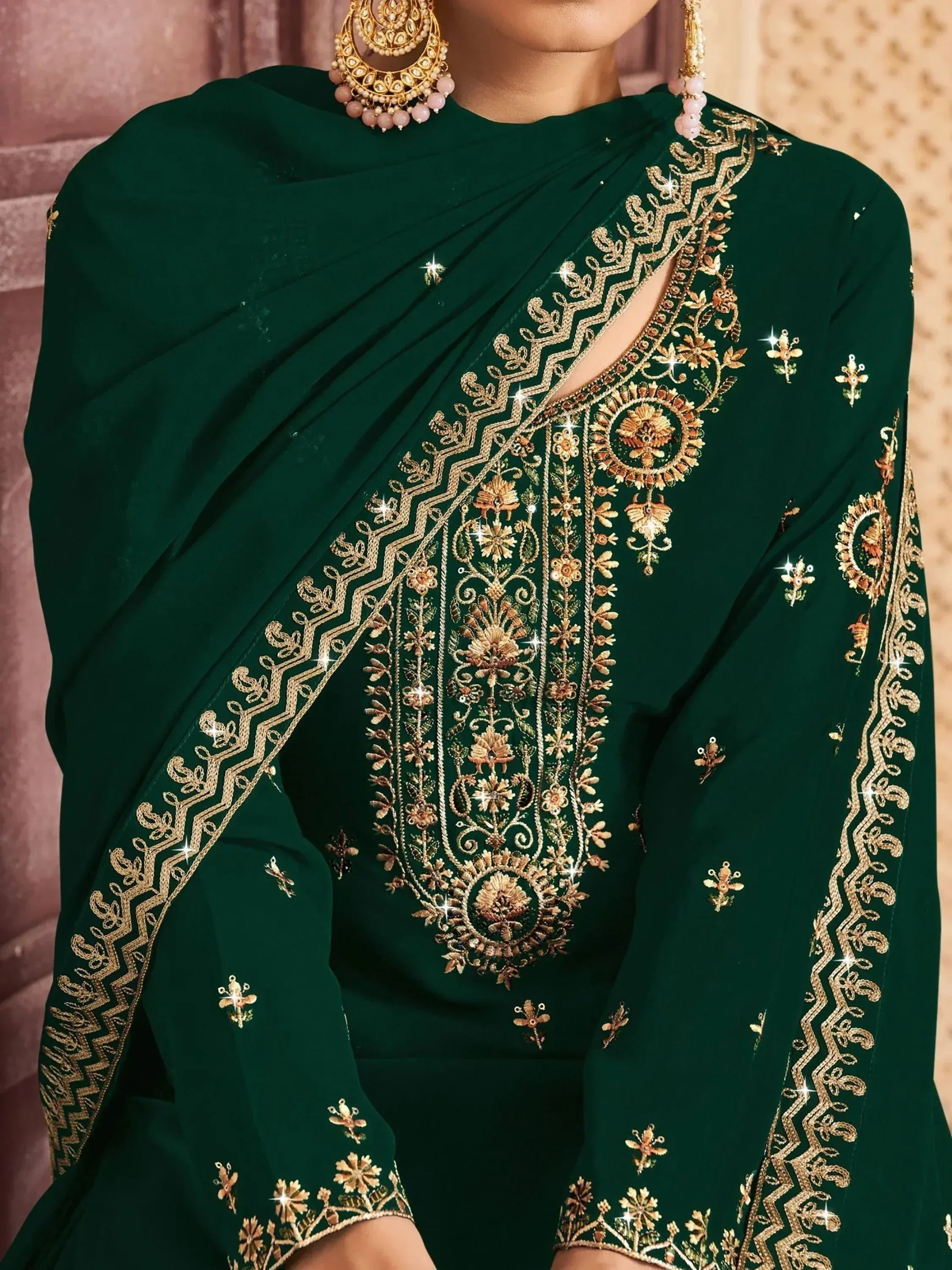 Emerald green designer saree with gold floral embroidery and matching jewelry for Indian ethnic wear