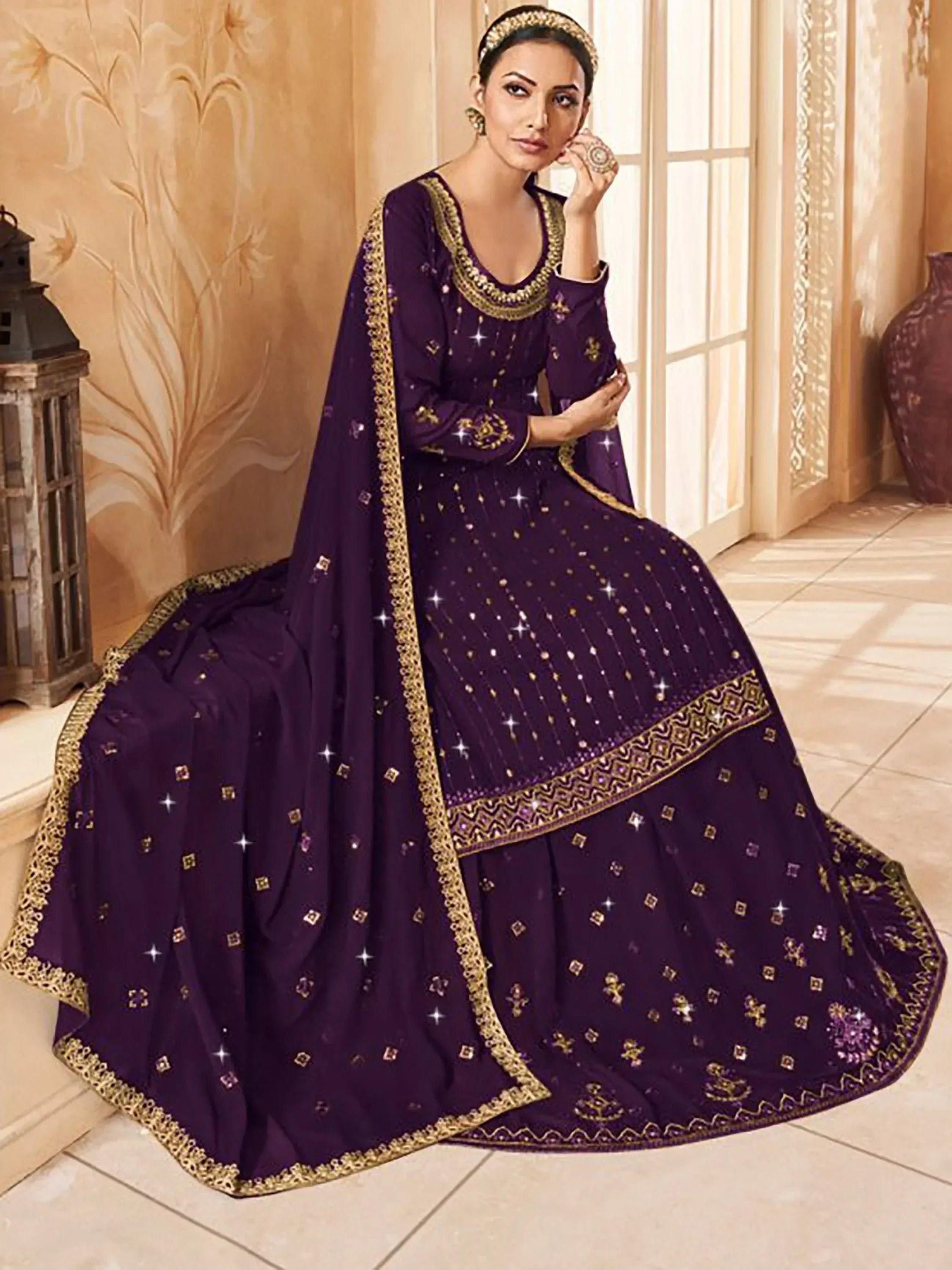 Elegant purple Indian anarkali suit with gold embroidery and mirror work, perfect for weddings and festive occasions.