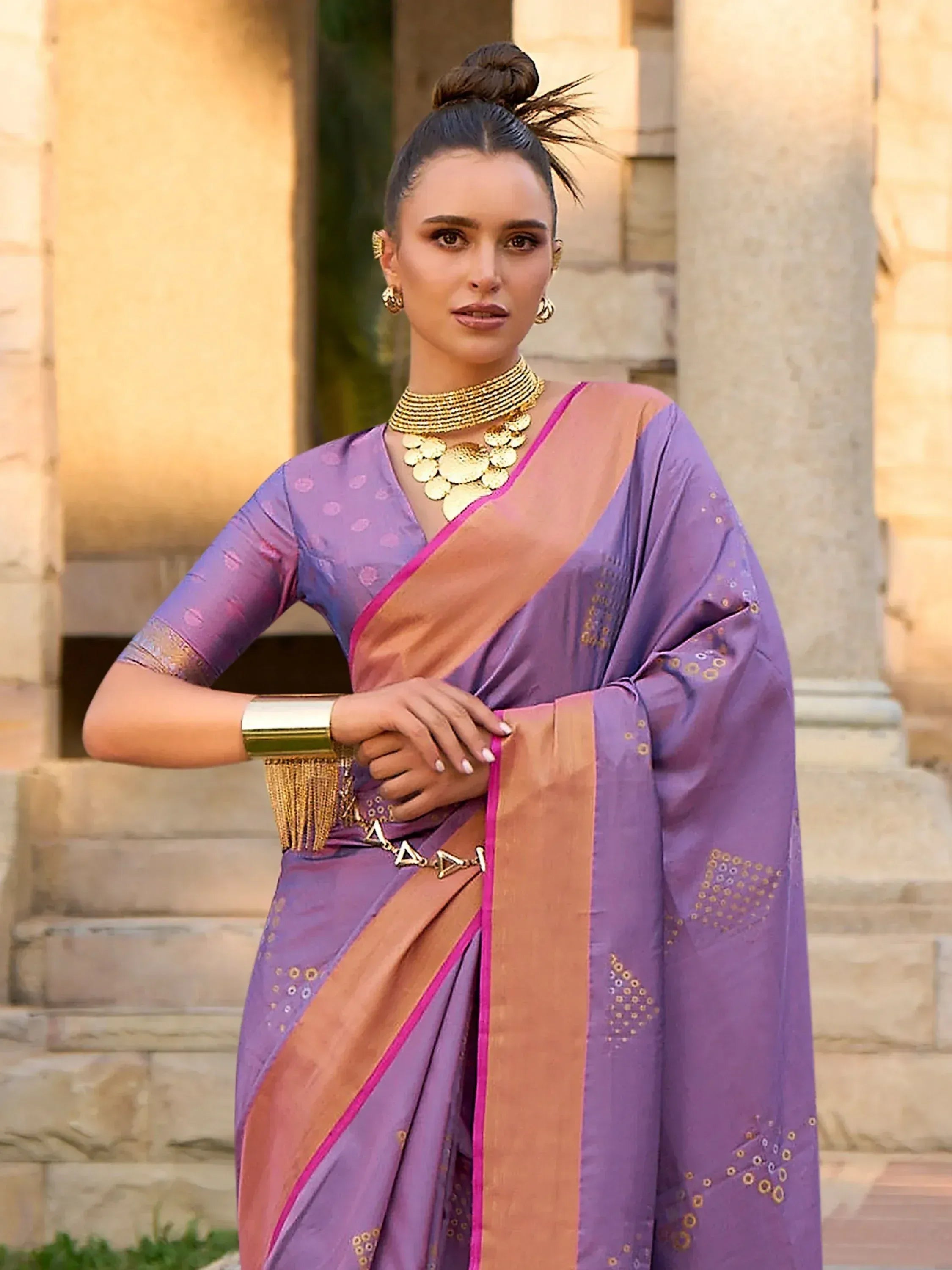 Purple and gold designer saree with intricate embroidery, perfect for Indian ethnic wear occasions.