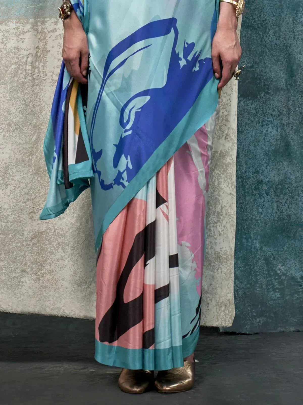Stylish printed saree with blue and pink abstract design, perfect for ethnic wear occasions.