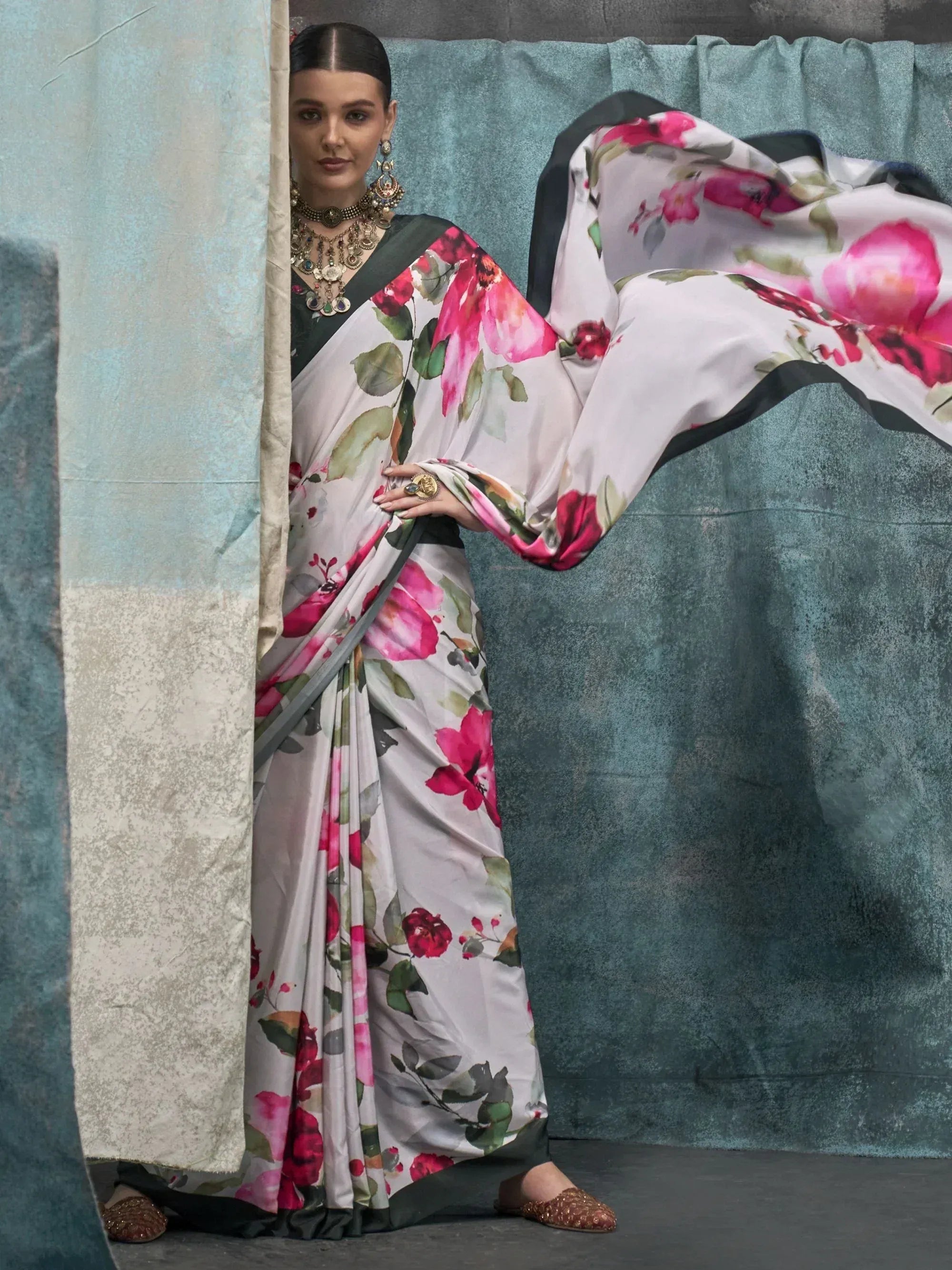 Woman in floral print saree with pink roses, ethnic wear, designer saree, Indian fashion