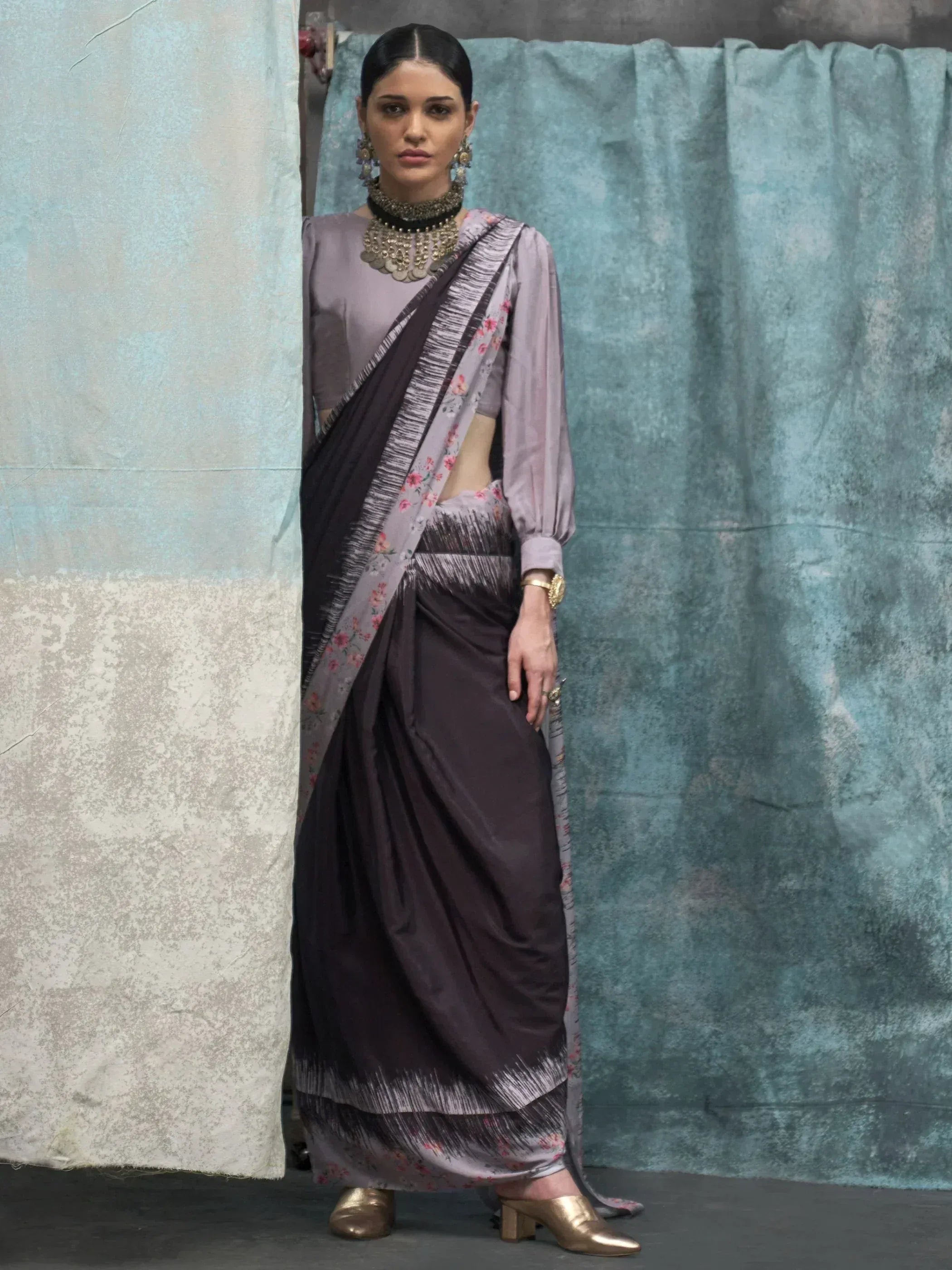 Woman in elegant purple floral saree with blouse, traditional Indian ethnic wear