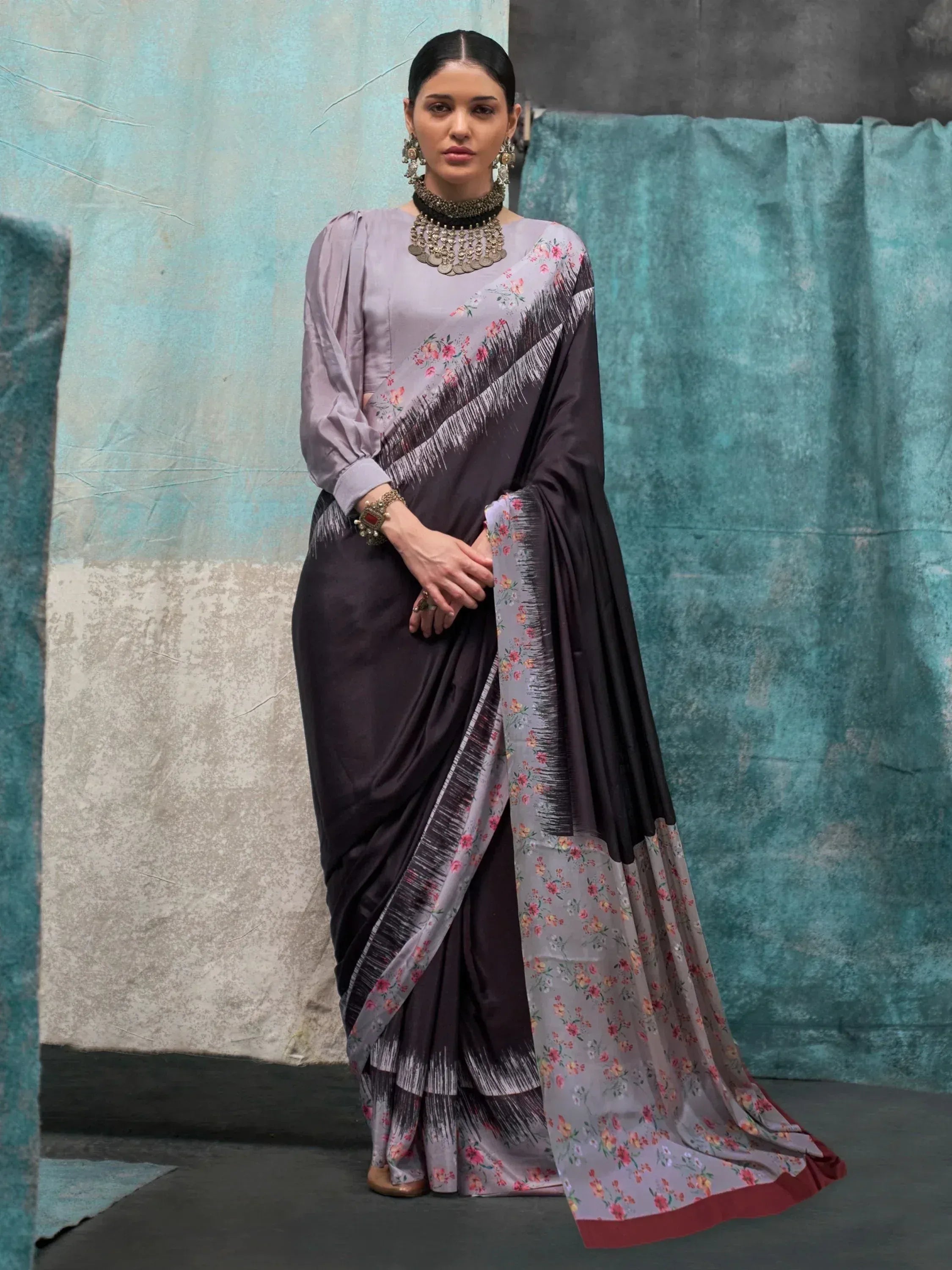 Elegant grey floral saree with black border, paired with matching blouse, perfect for Indian ethnic occasions.