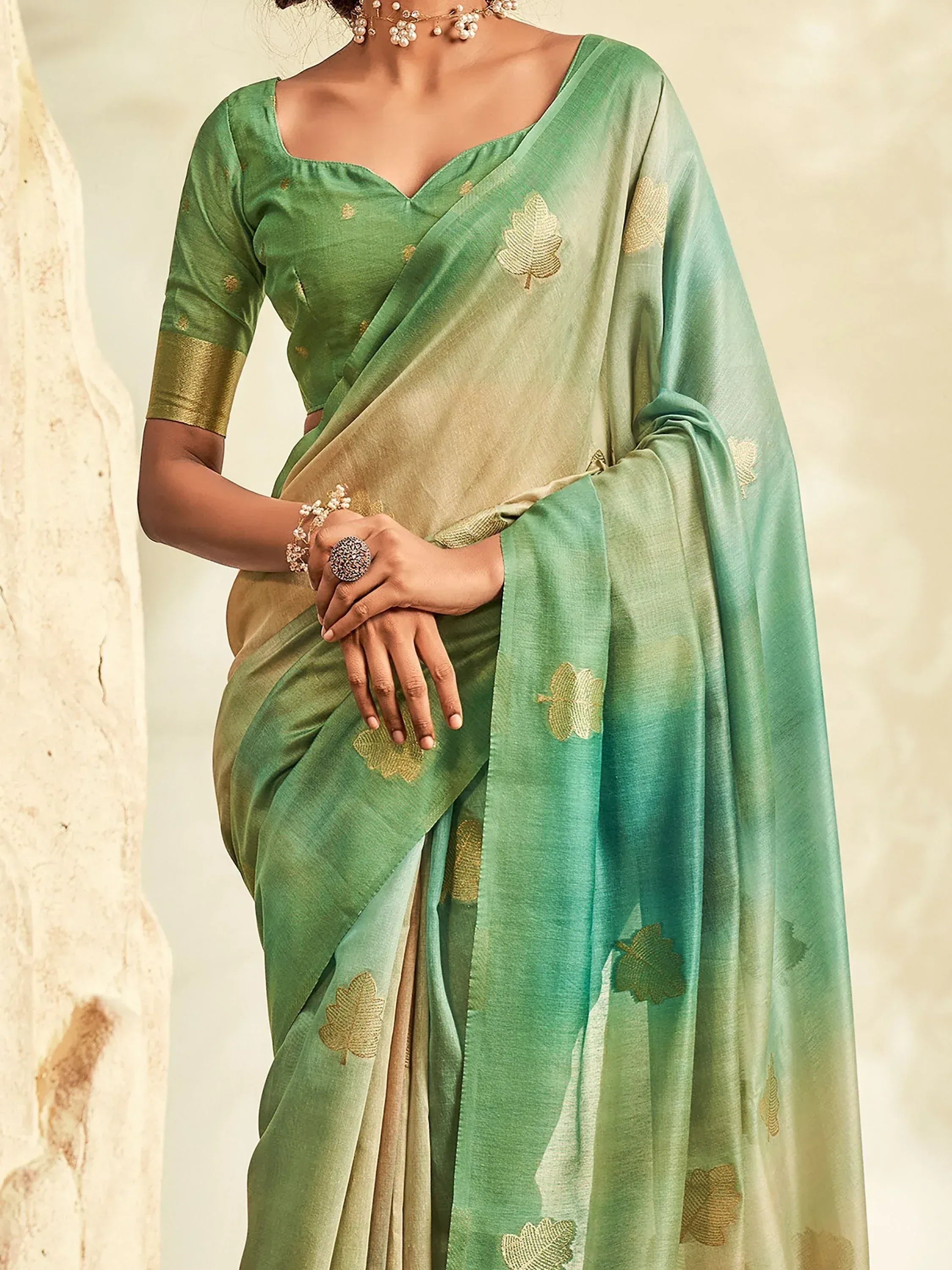Green ombre saree with gold leaf embroidery, paired with matching blouse for ethnic wear