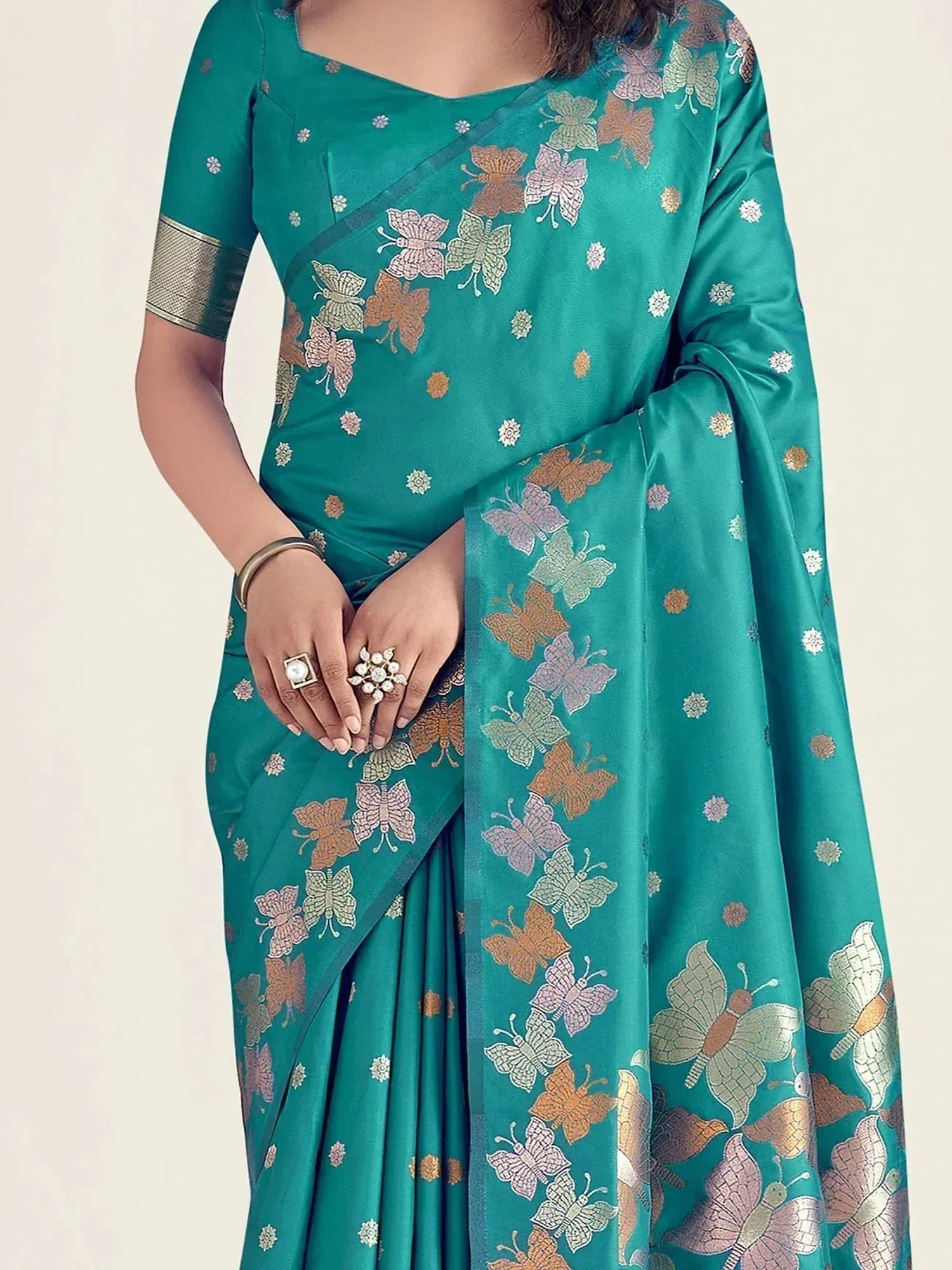 Teal saree with colorful butterfly print, perfect for Indian ethnic wear occasions