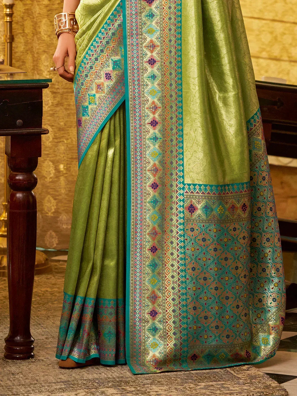 Green saree with colorful geometric border, ethnic Indian wear
