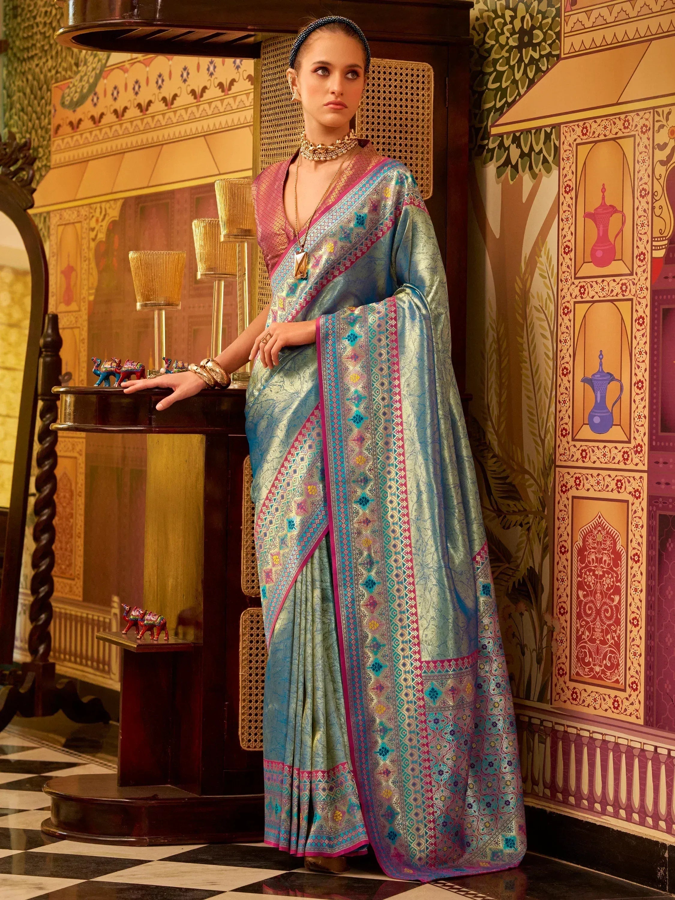 Elegant blue and pink designer saree with intricate patterns, perfect for Indian ethnic wear