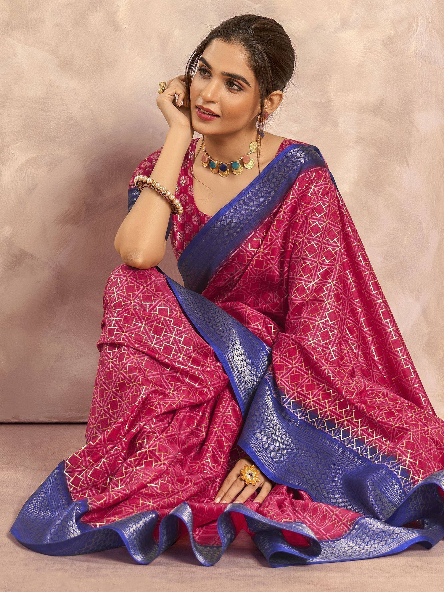 Woman in pink and blue designer saree with gold geometric print, perfect for Indian ethnic occasions