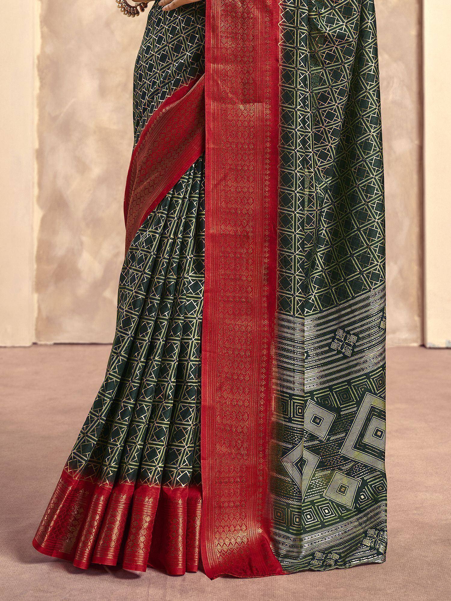 Green and red ethnic saree with geometric gold patterns and woven border, perfect for festive occasions.