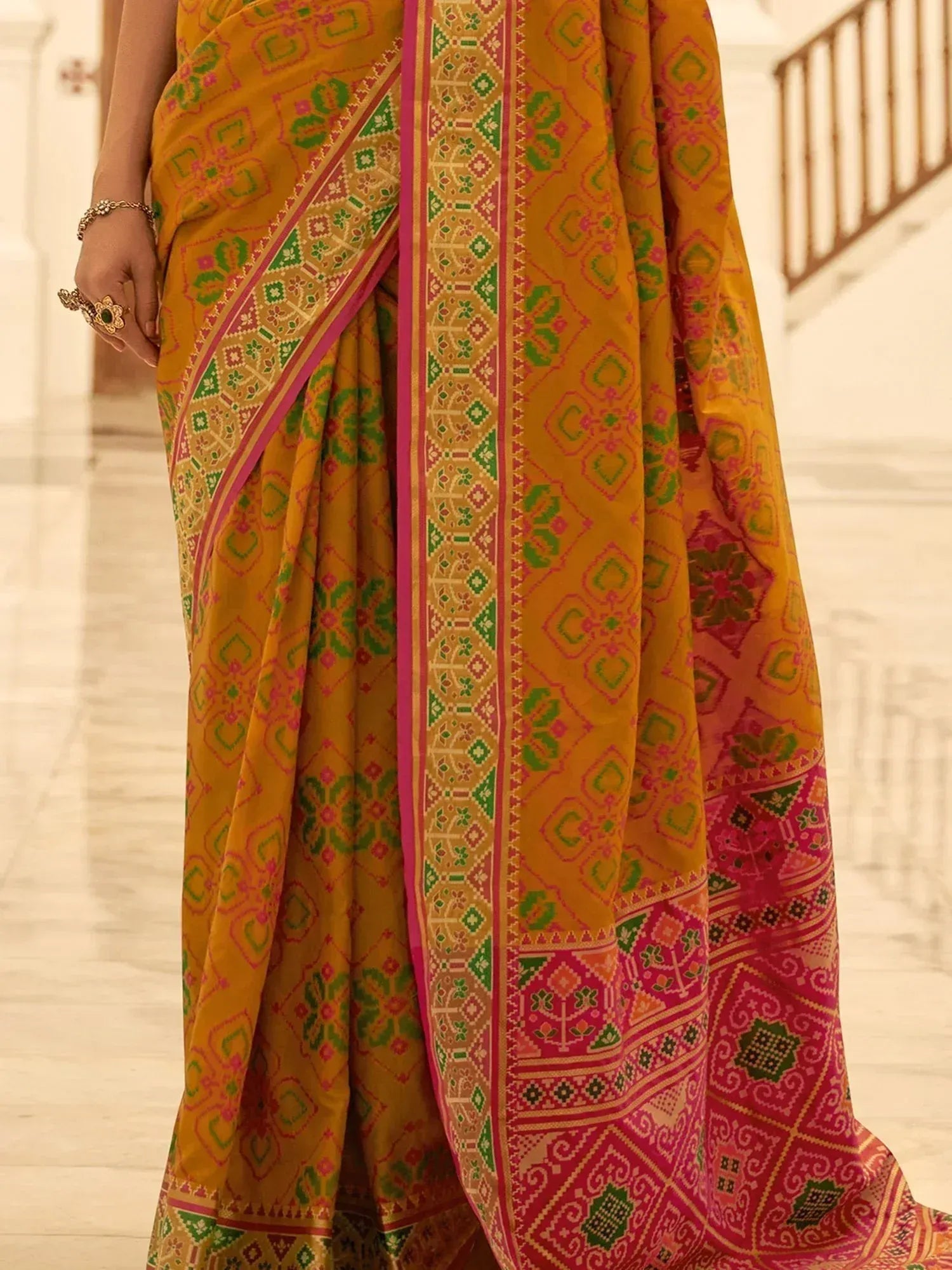 Yellow ethnic saree with green and pink geometric print, perfect for Indian occasions
