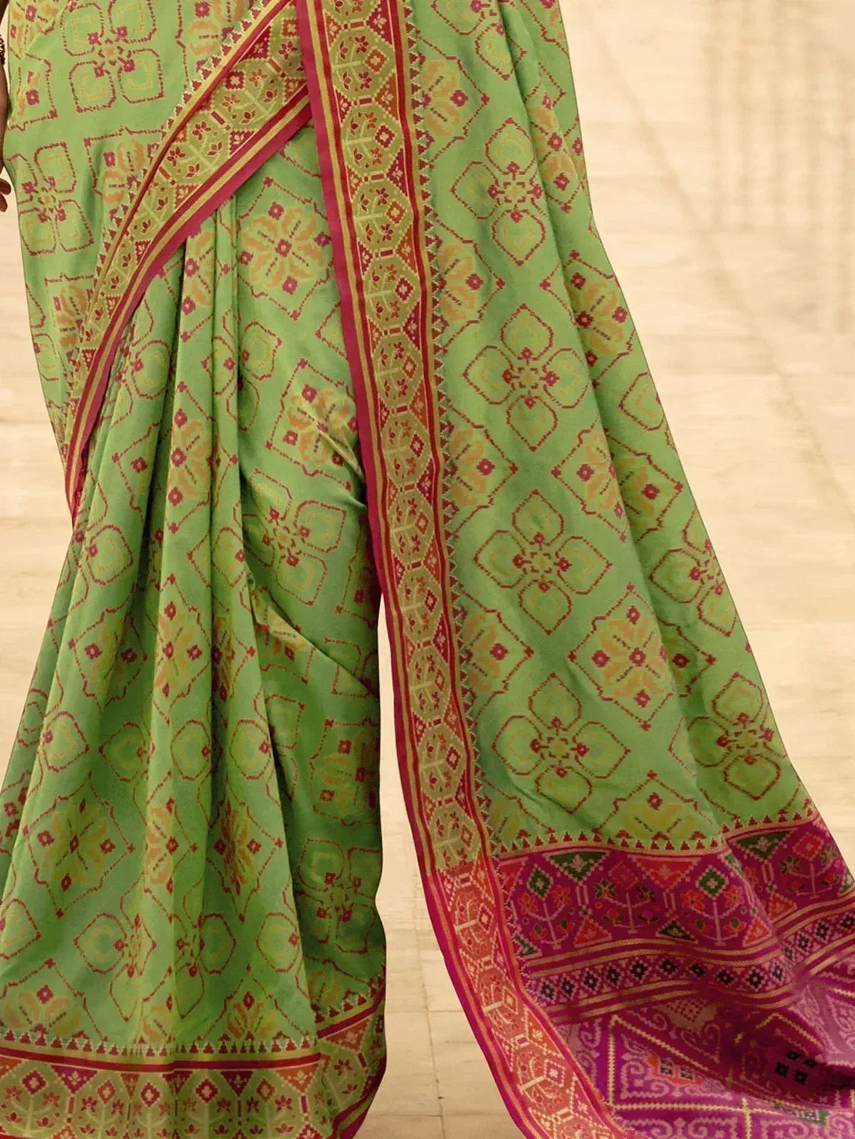 Green printed saree with red and gold border, ethnic Indian wear