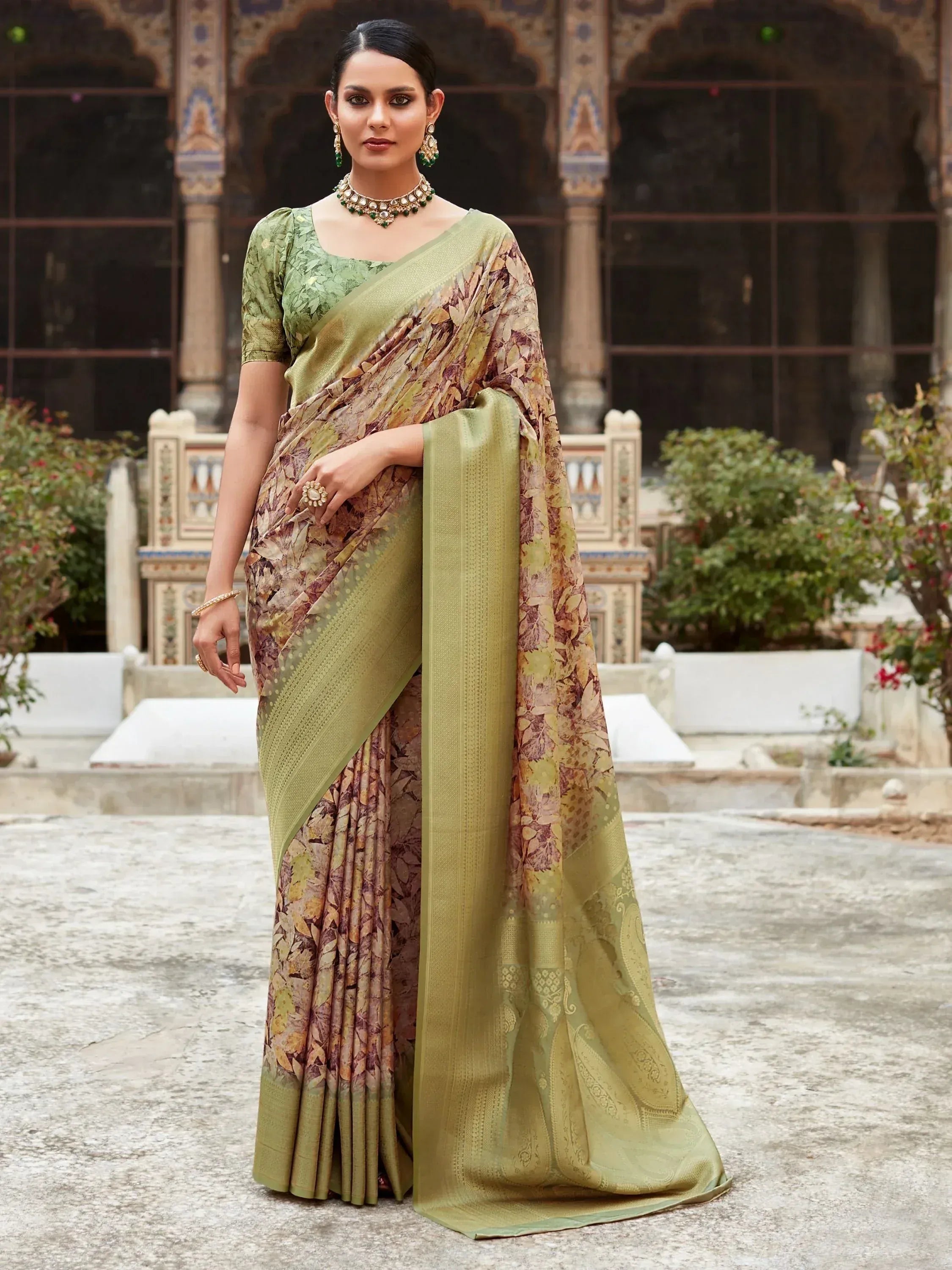 Woman in olive green floral print saree with matching blouse, traditional Indian ethnic wear