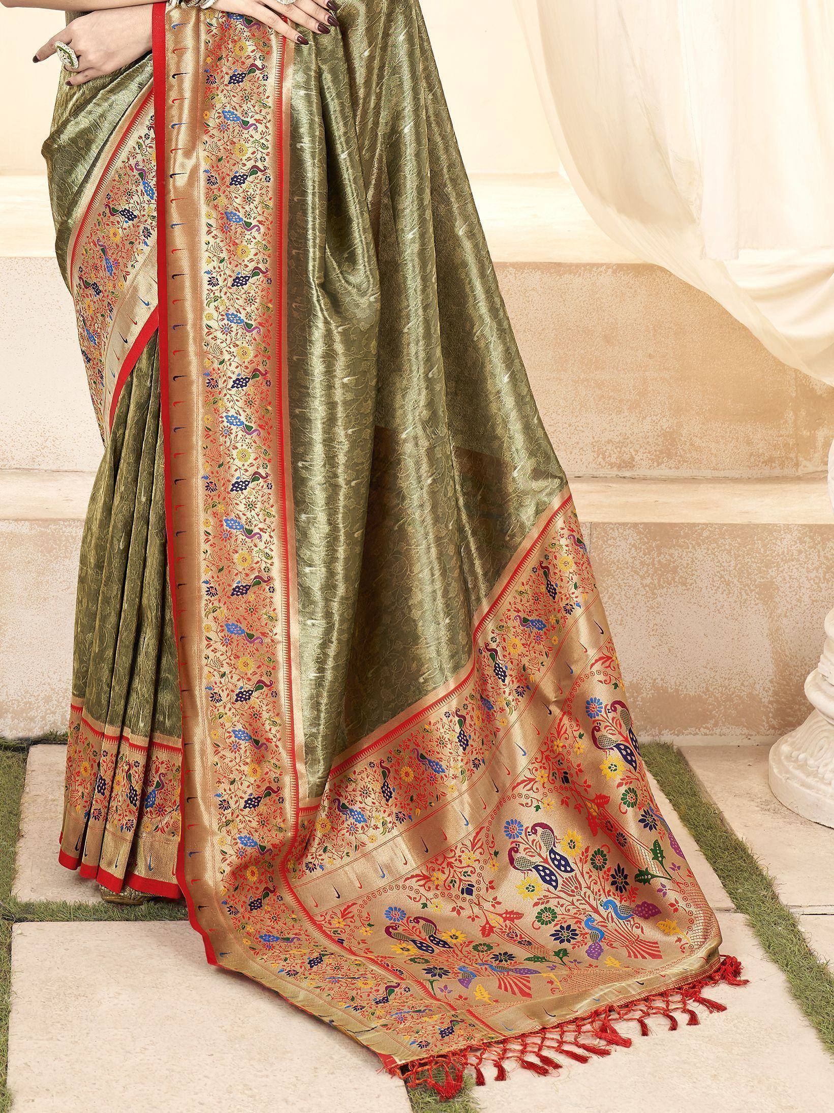Olive green saree with peacock and floral embroidery, red border, and tassels, ideal for ethnic occasions