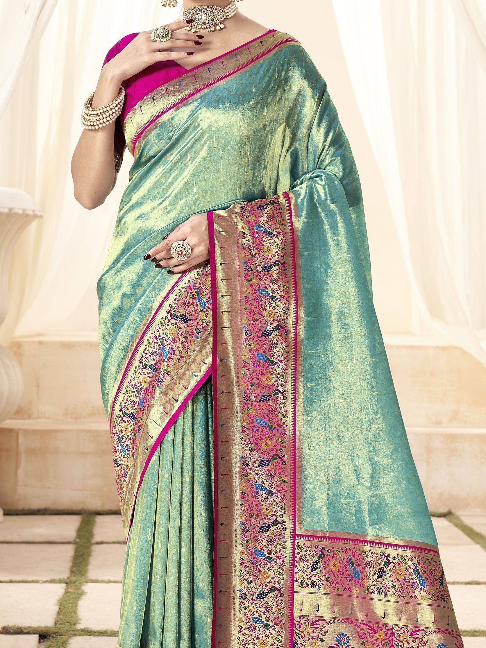 Teal silk saree with peacock embroidery, pink border, and matching blouse for Indian ethnic wear